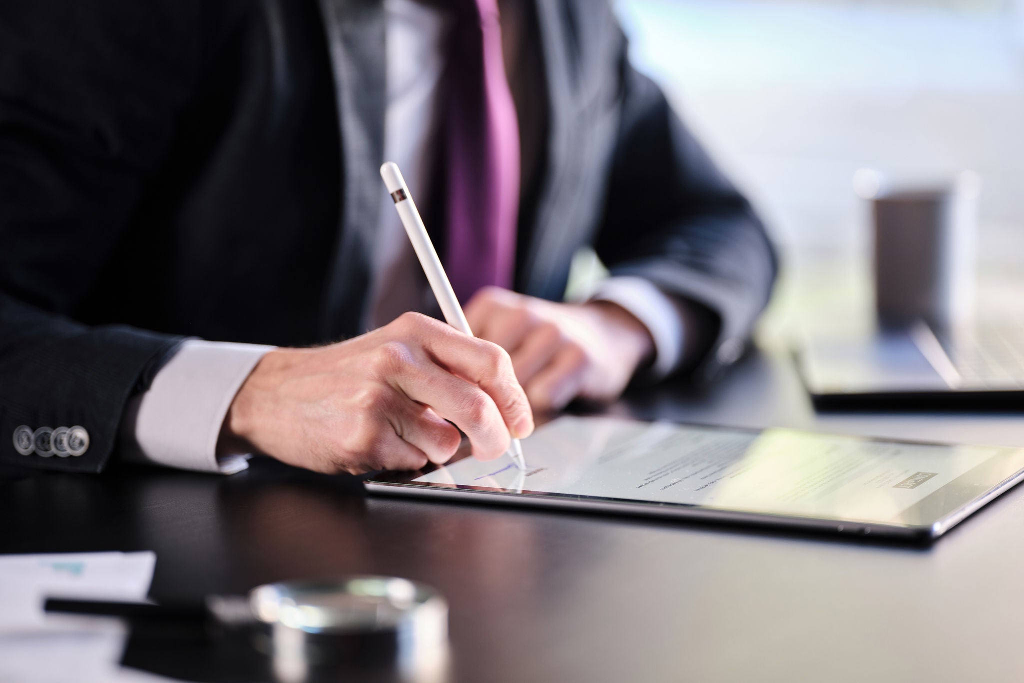 A man signing on the contract