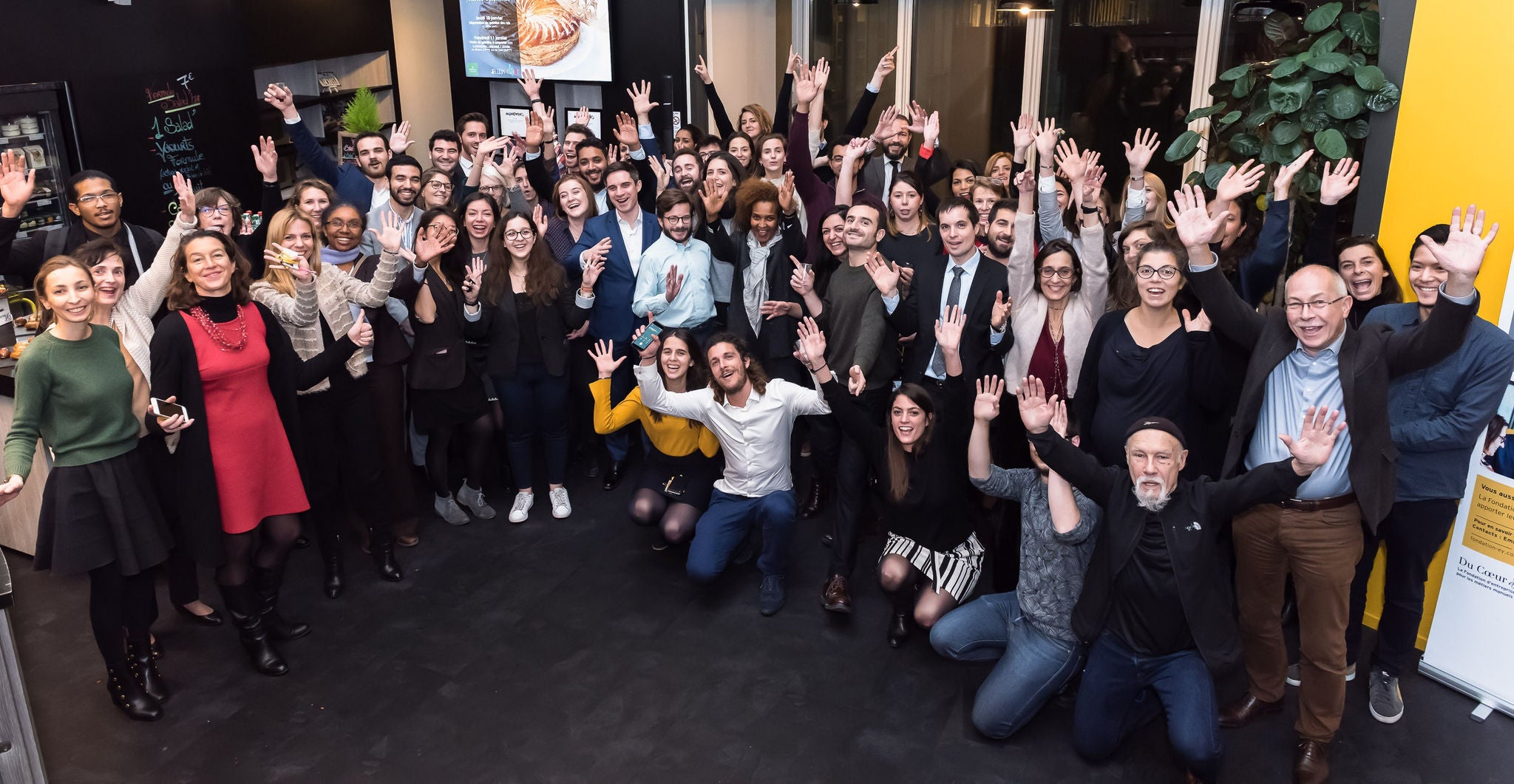 Office employees taking group picture