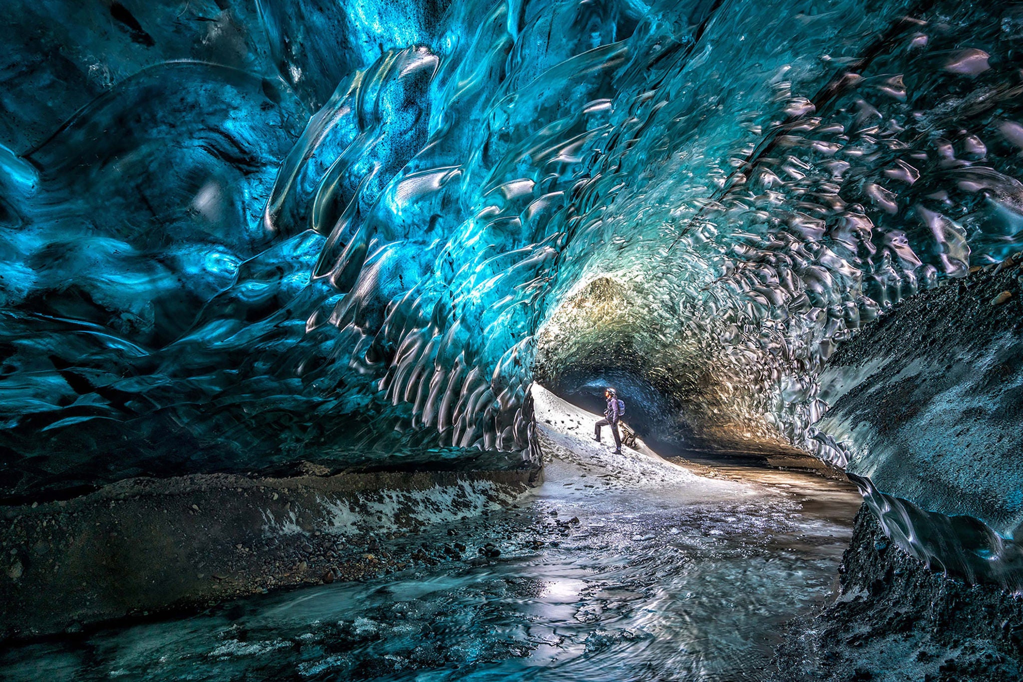 Man standing in frozen cave