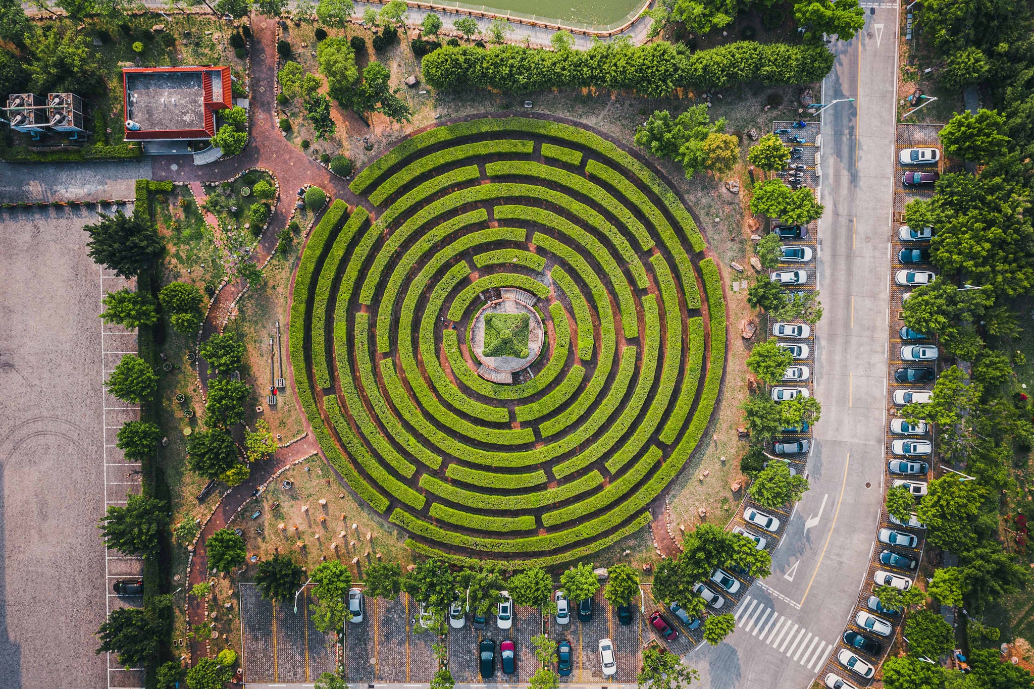 aerial-view-of-a-circular-garden-maze-and-green-pavilion