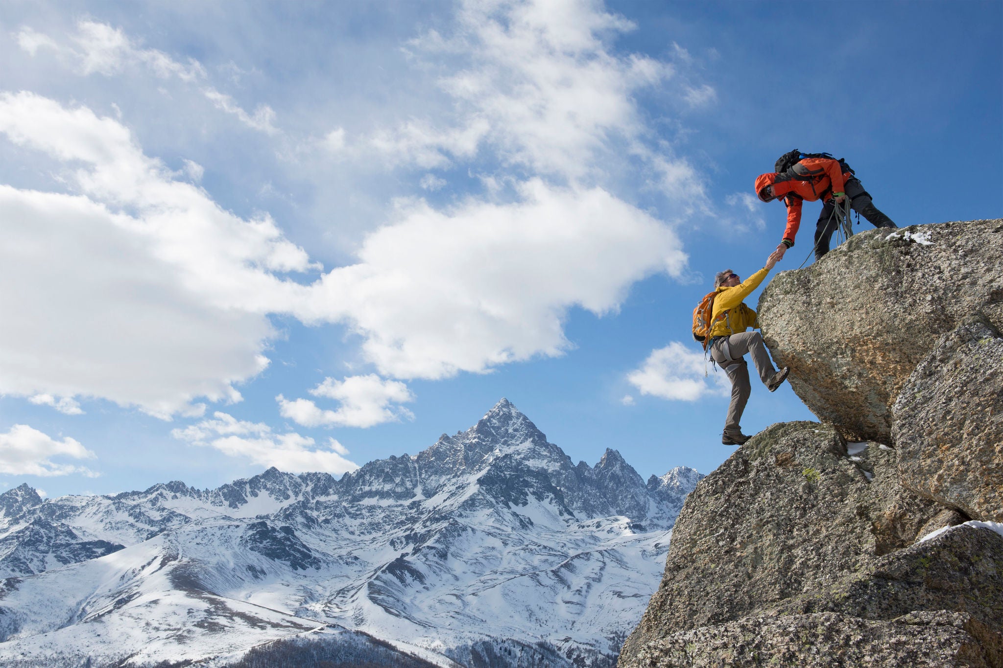 Climber extends helping hand to teammate