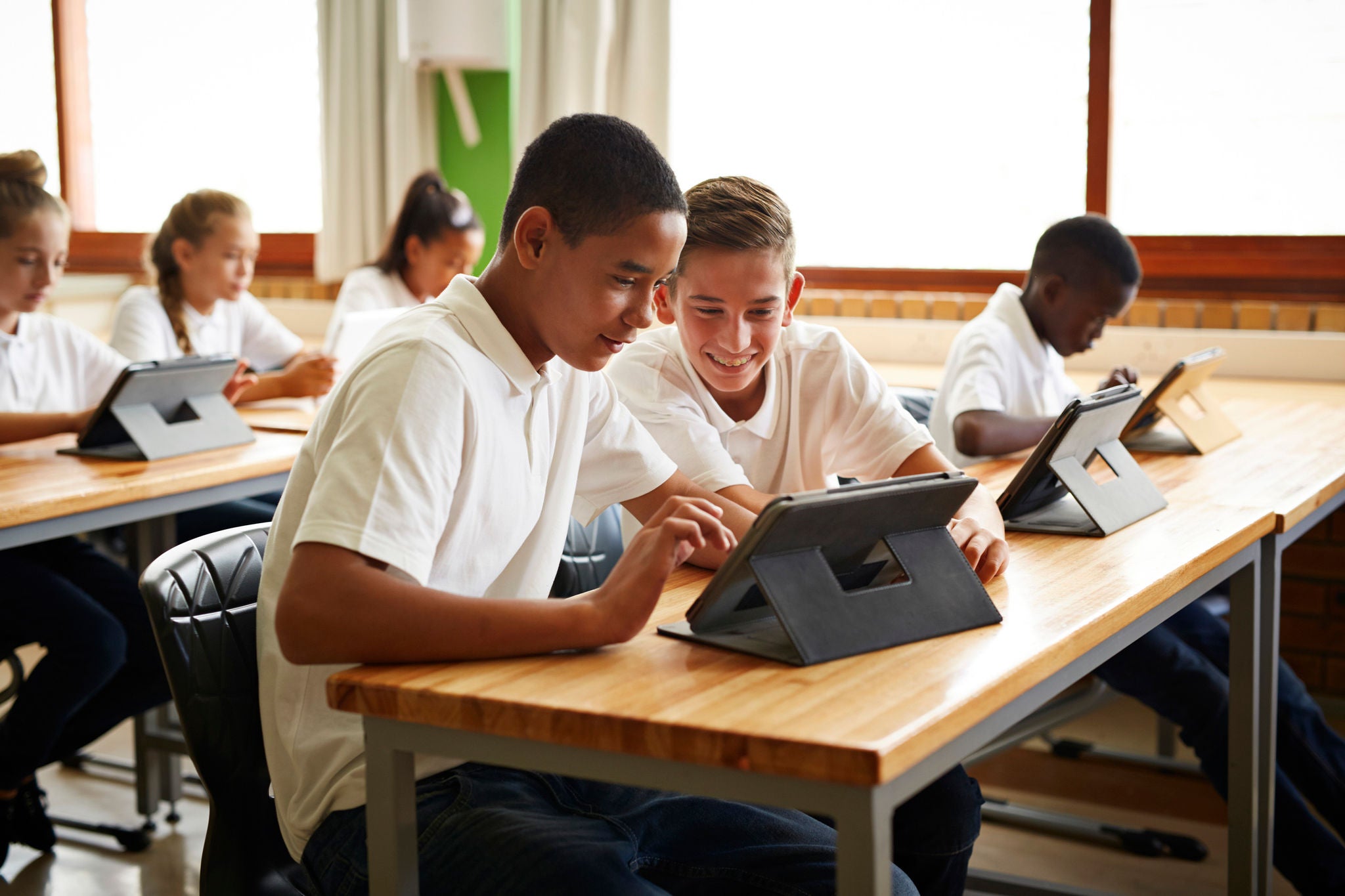 School students in class working with tablets