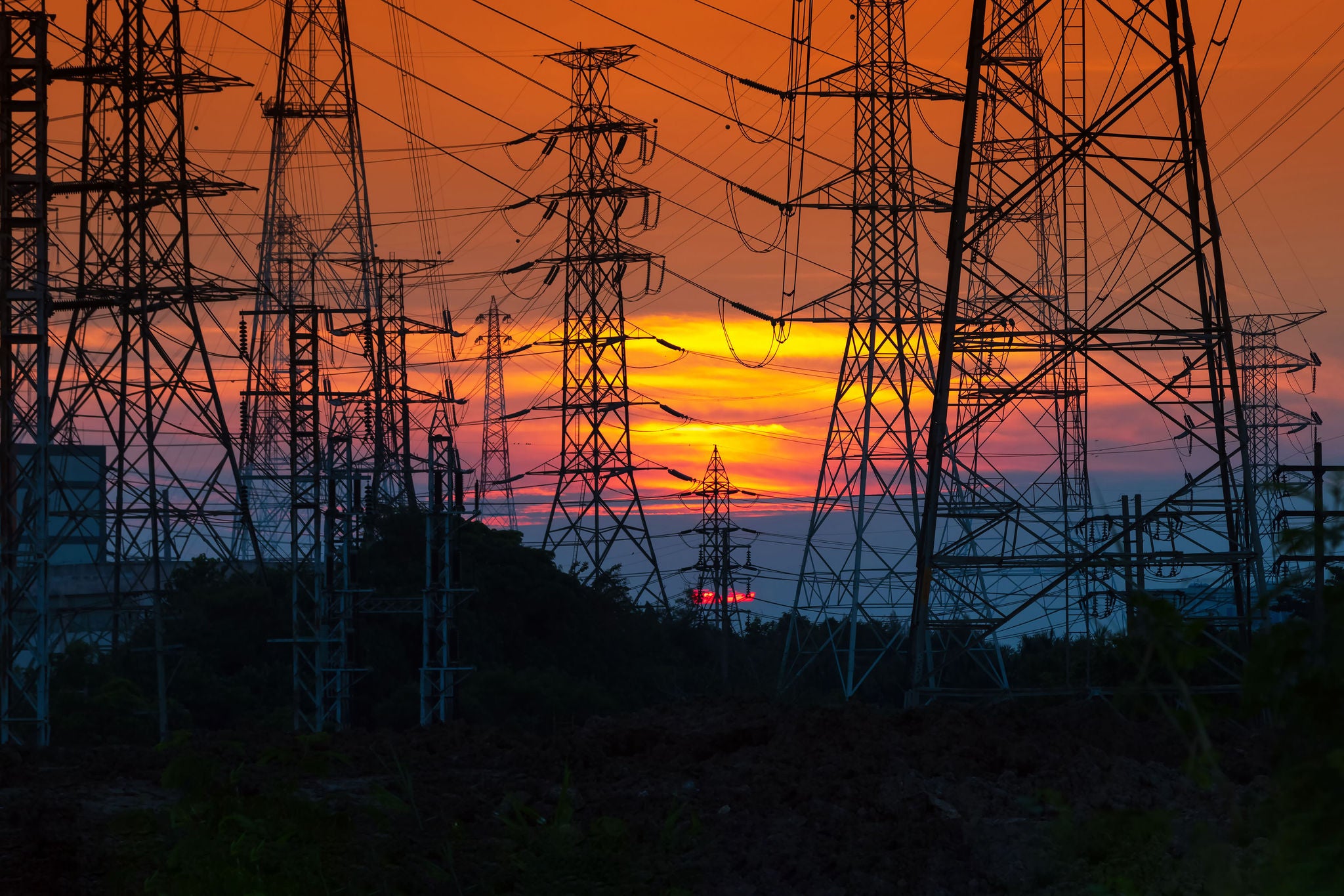 Electricity distribution station and towers at sunset