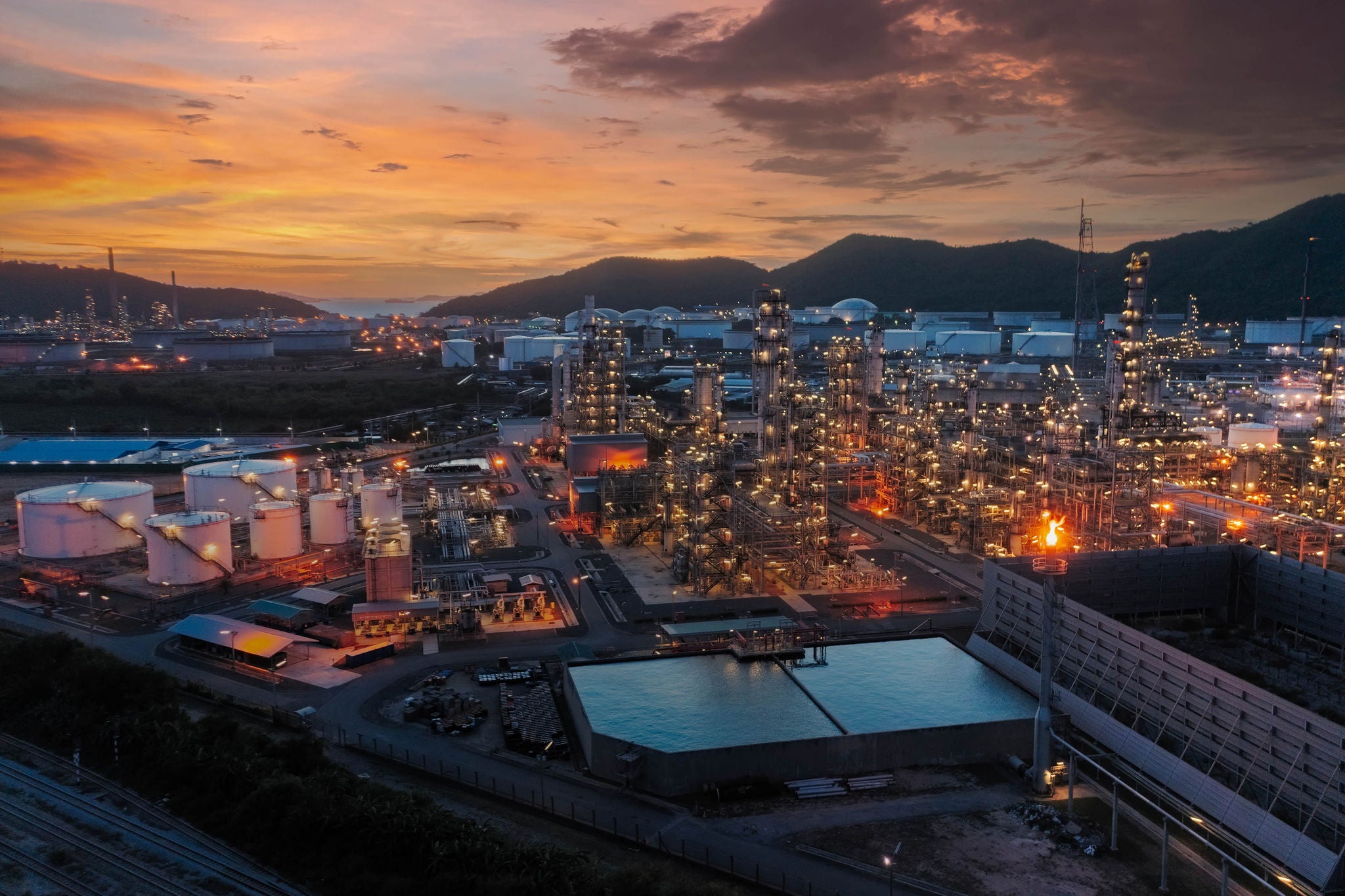 Aerial view Oil refinery at dusk for oil or gas industry, Energy or Oil Industrial concept background.