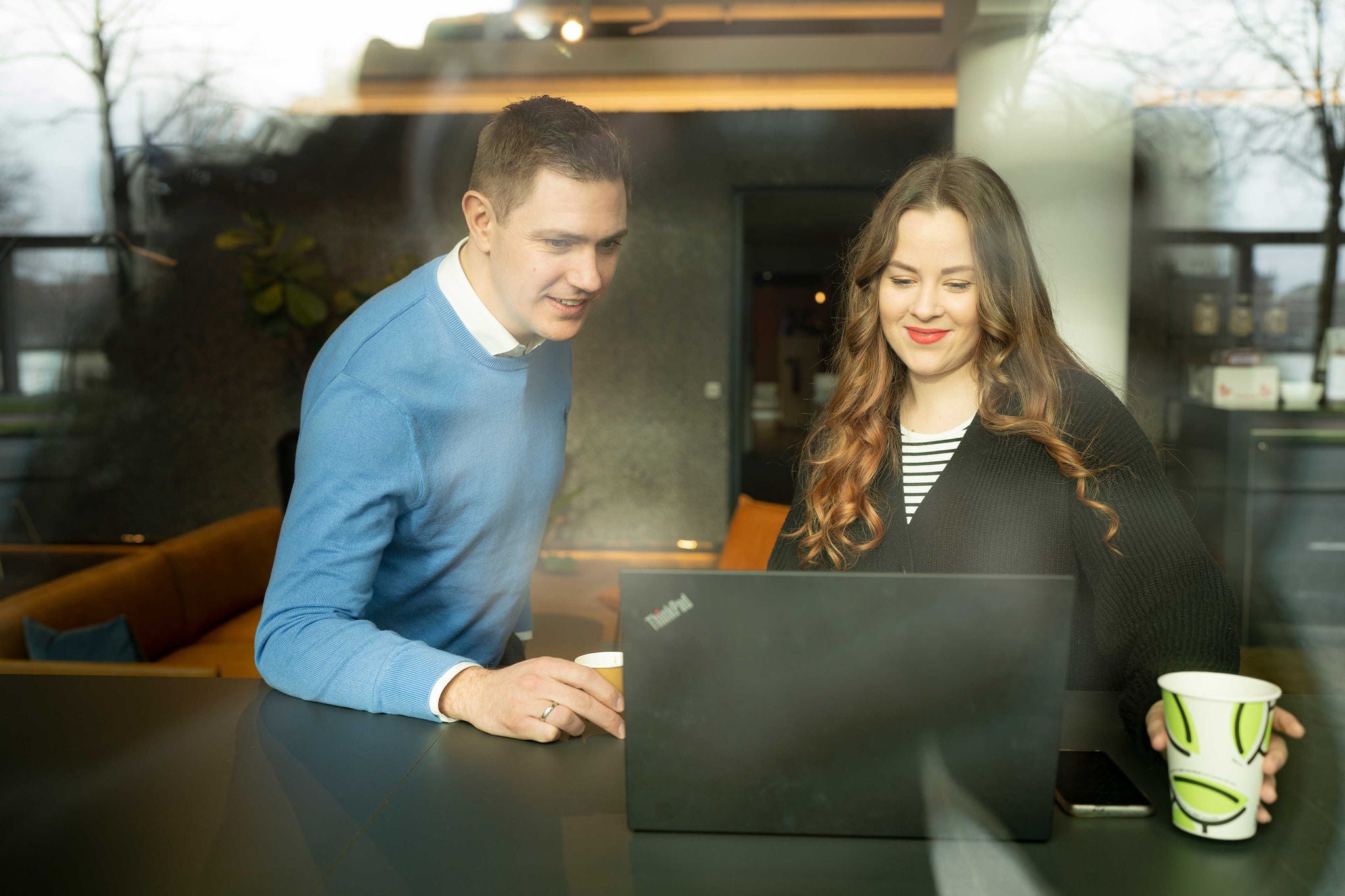 Two employees are discussing