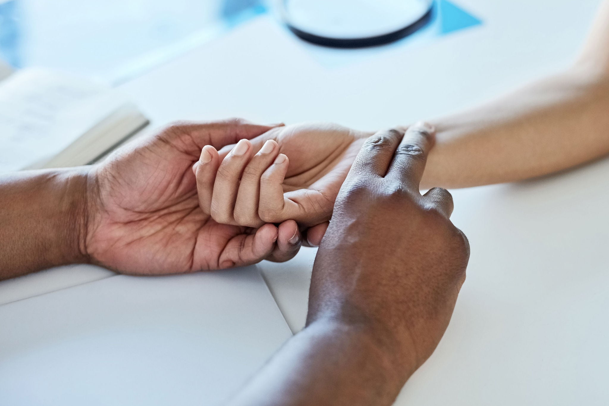 Closeup shot of a doctor taking a patient's pulse