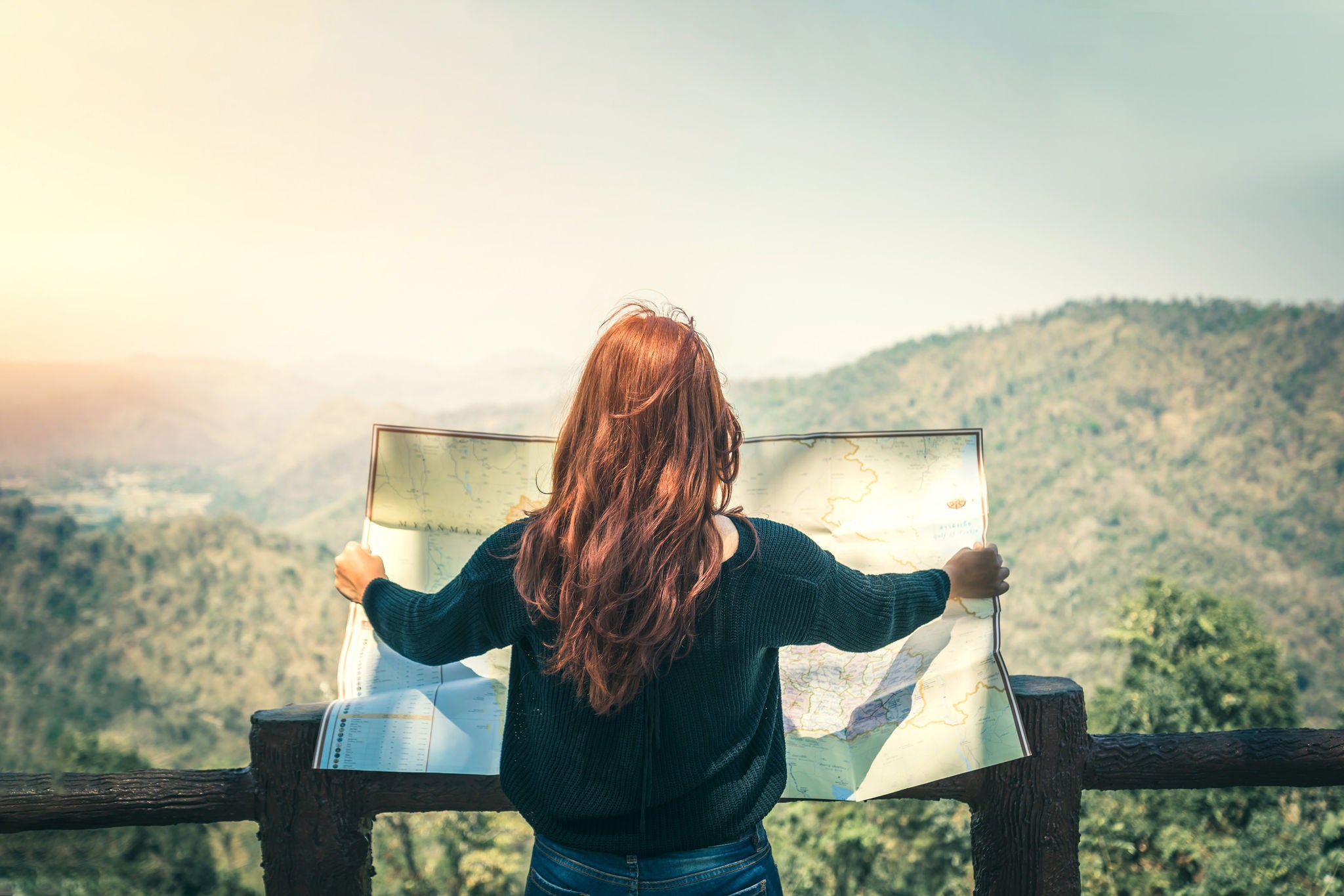 Travelers explore the mountainous forest map.