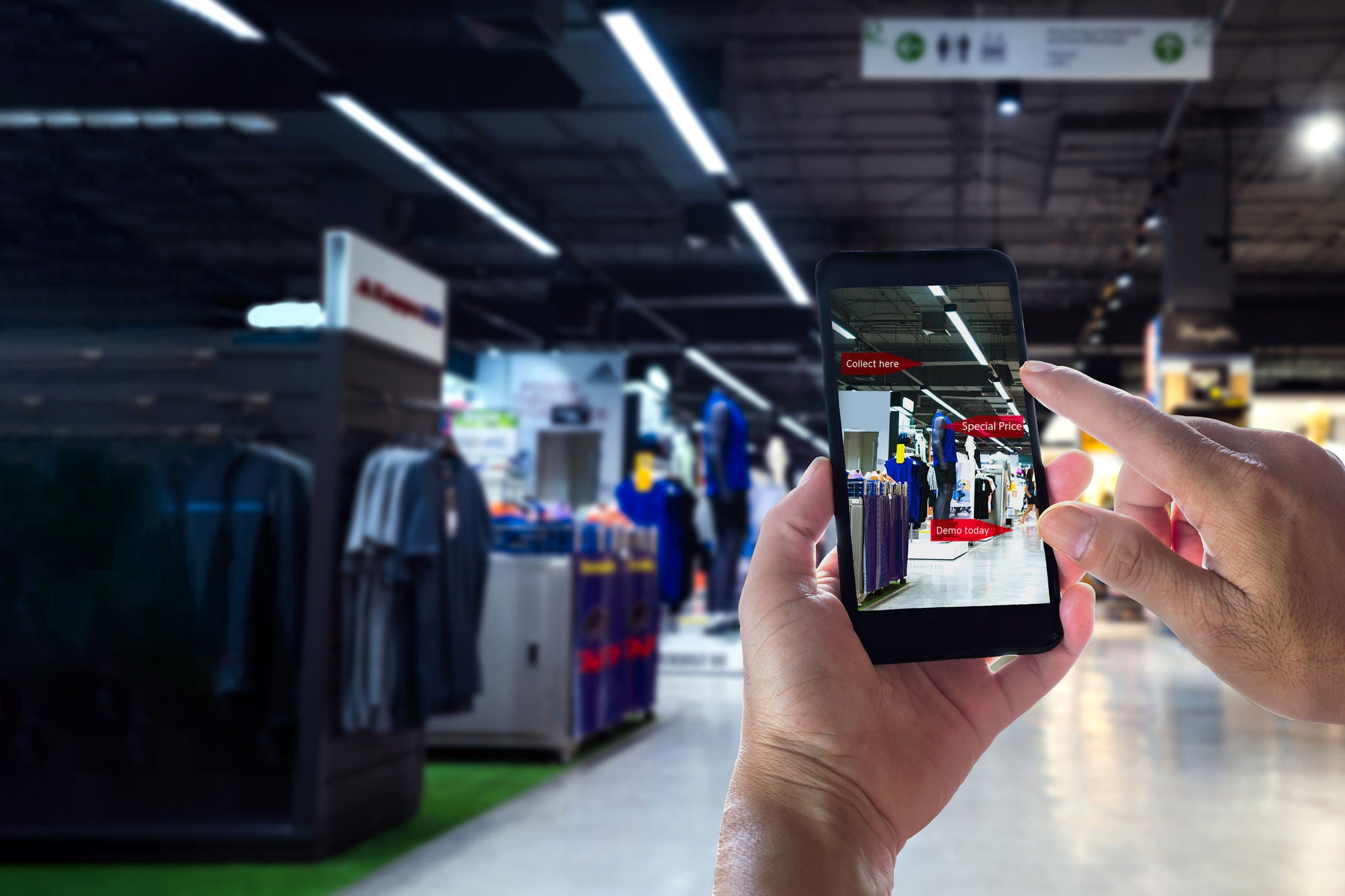 ey-hand-holding-smart-phone-using-ar-application-to-check-sale-price-in-shop