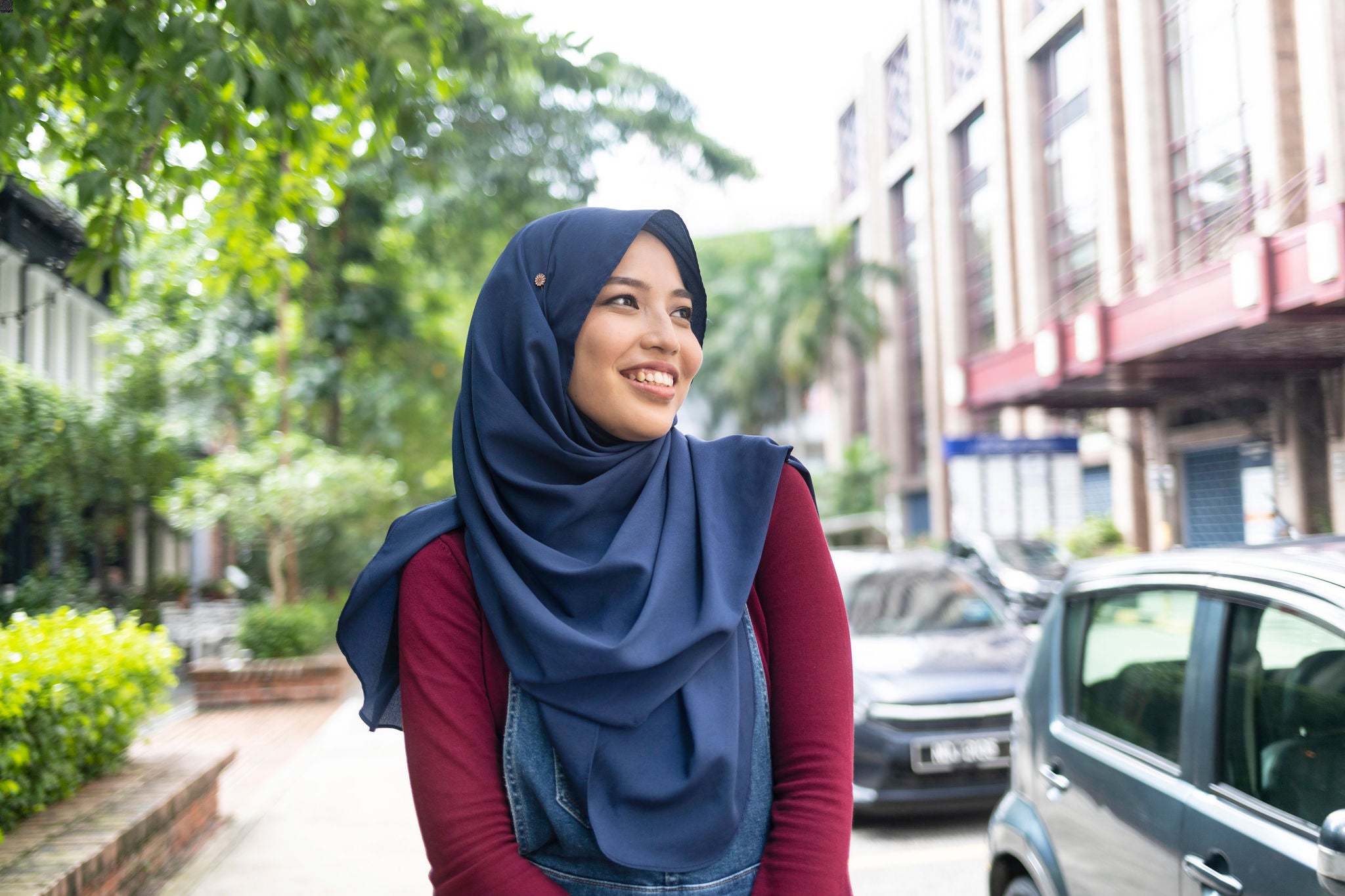 Smiling tourist in the city walking on street