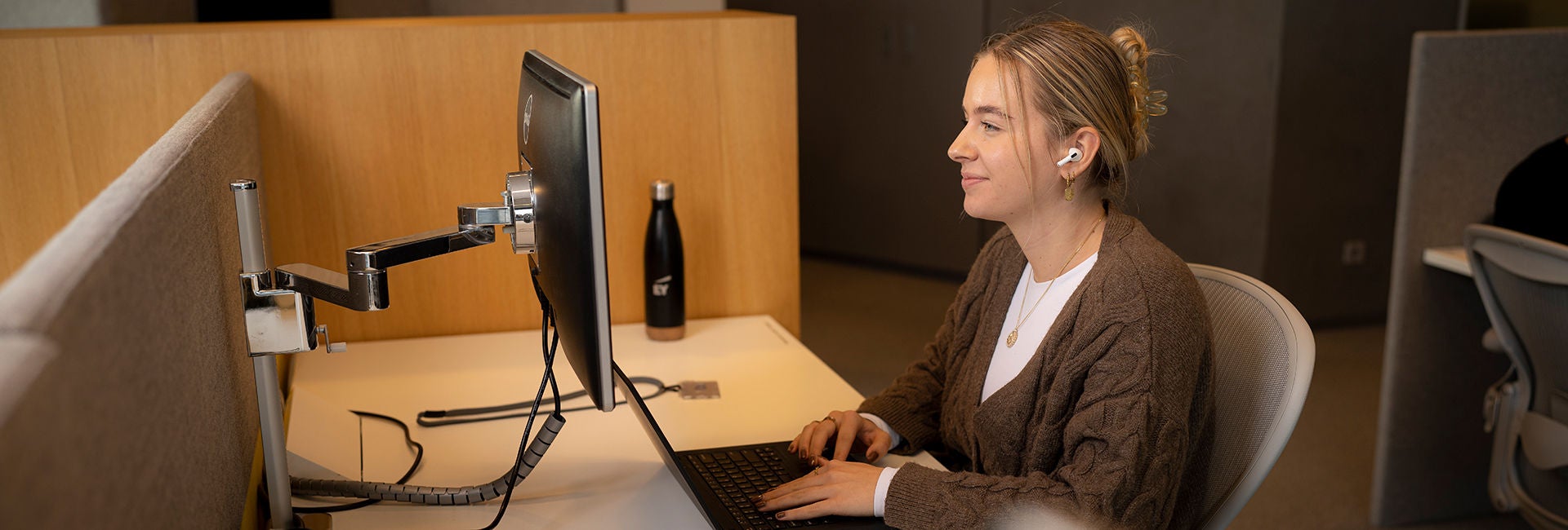 A lady is working on laptop