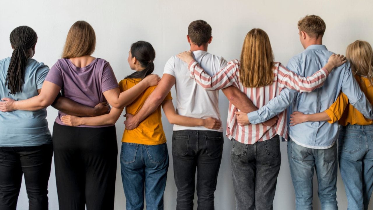 Employees holding altogether and posed for a photo