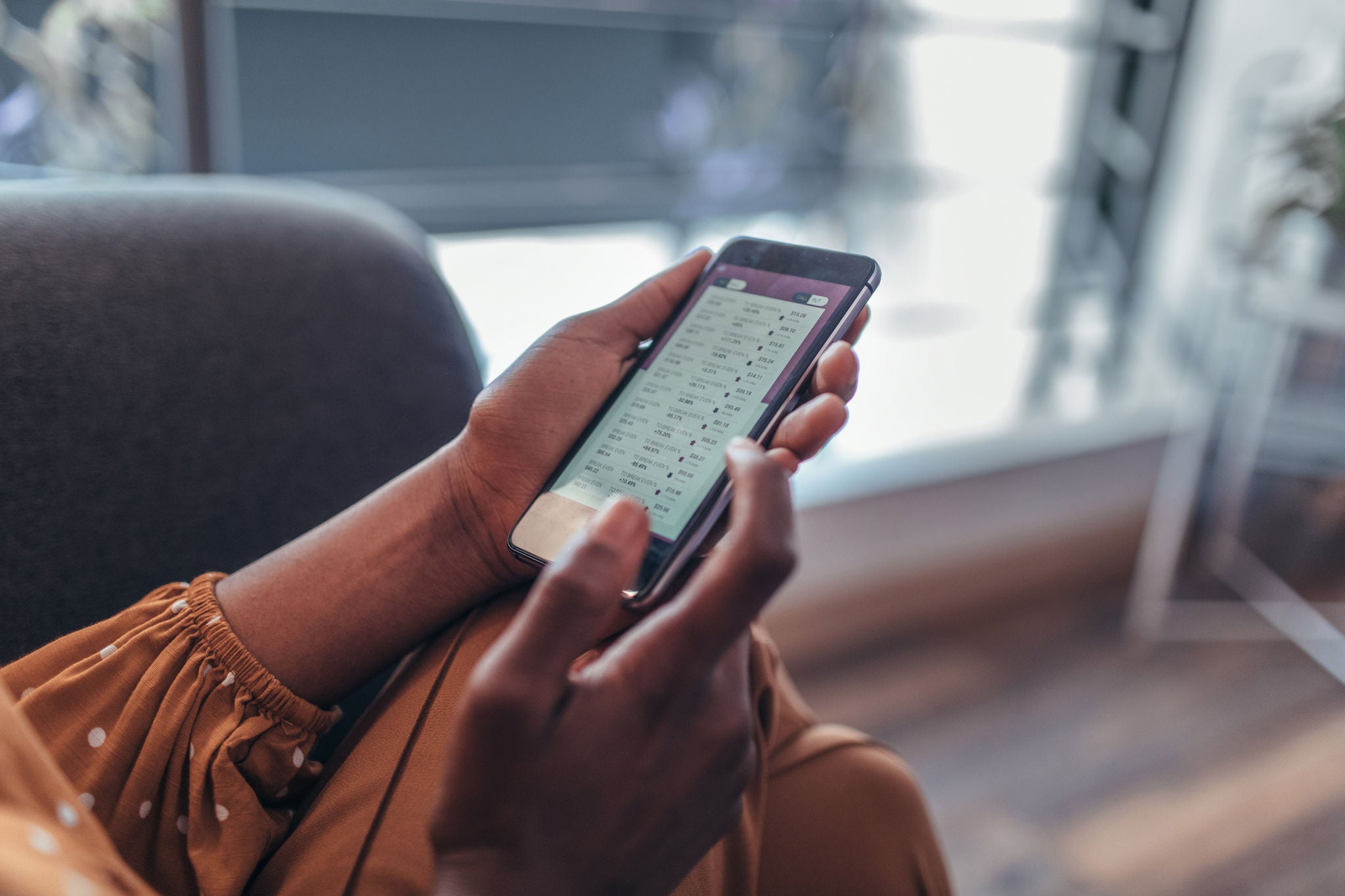 Close up of women's hands holding smartphone