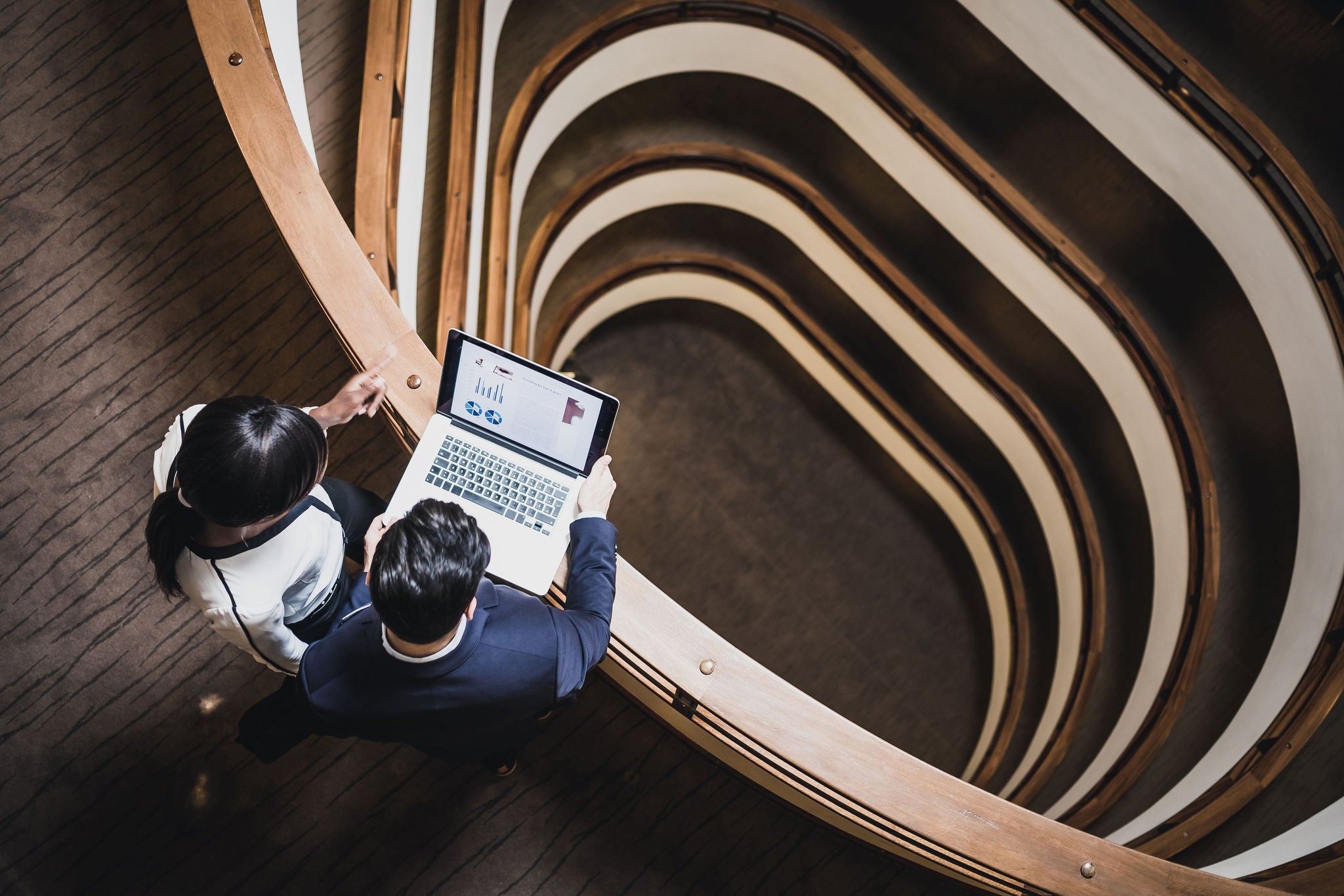 Ariel view of business people having a meeting on the hallway