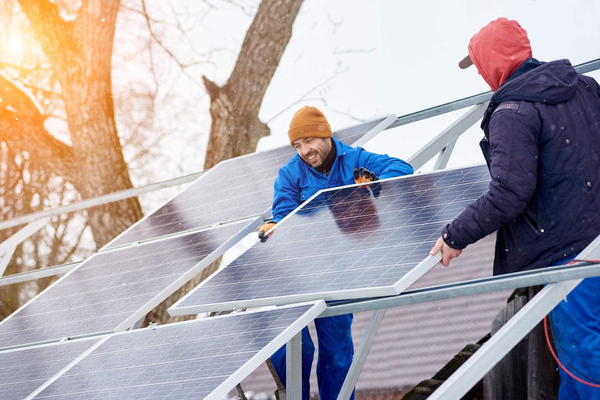 Men installing the solar panels