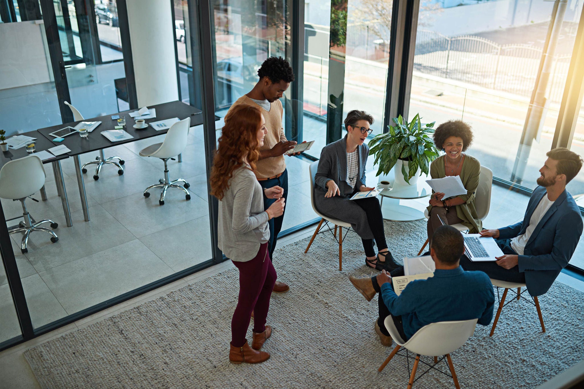 Strengthening partnerships through teamwork. Shot of a group of creatives having a meeting in a modern office.