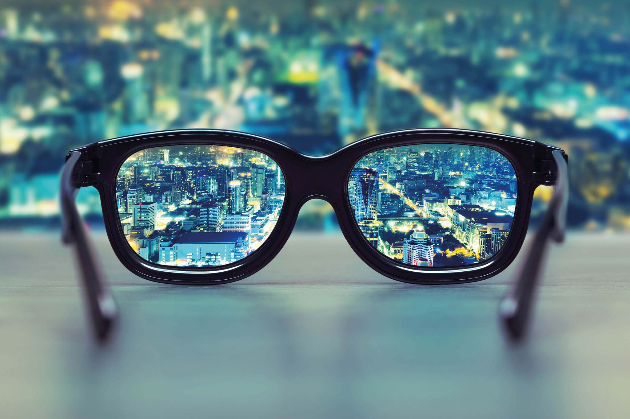 Night cityscape focused in glasses lenses