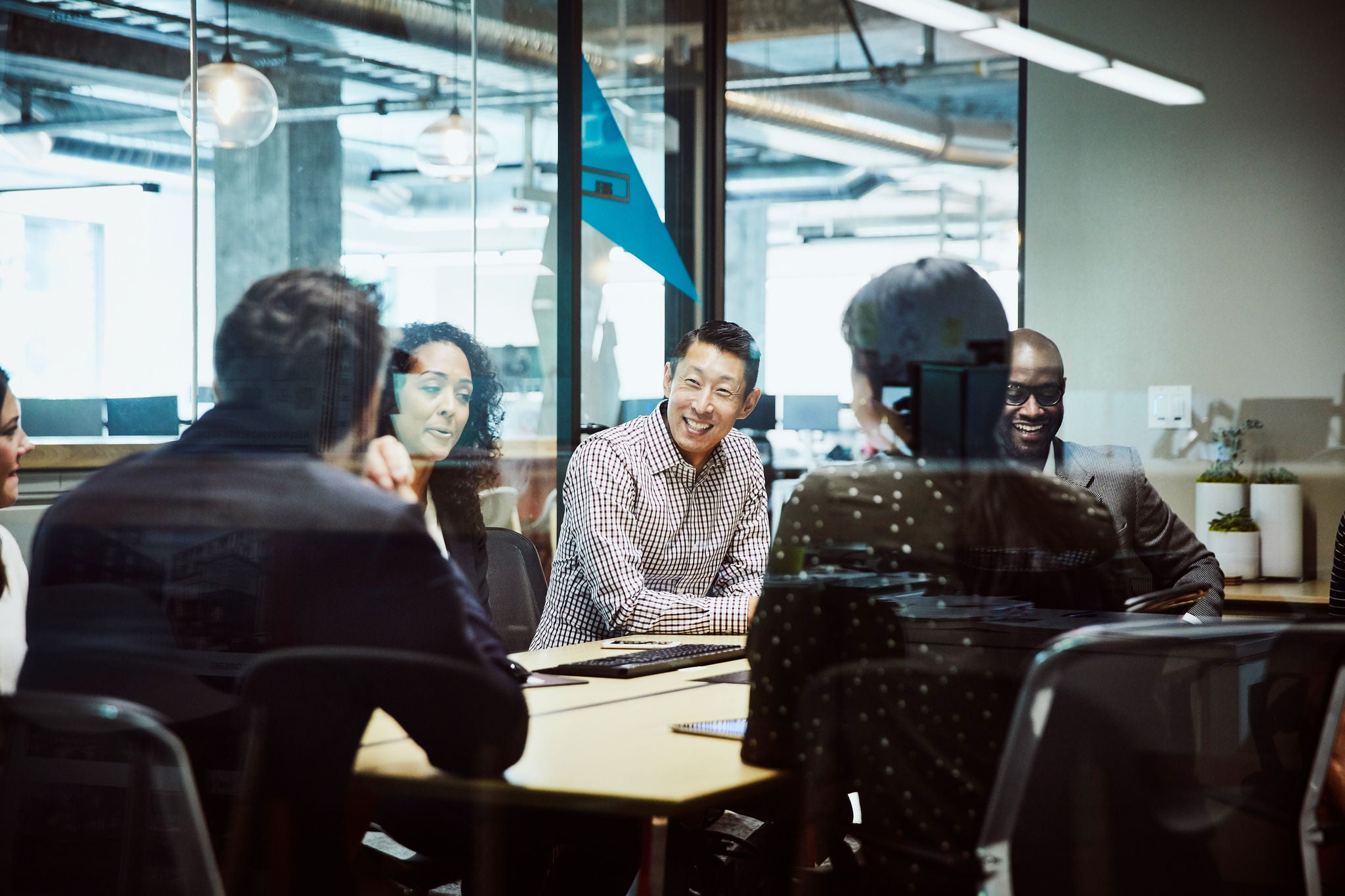 A group of people in meeting room