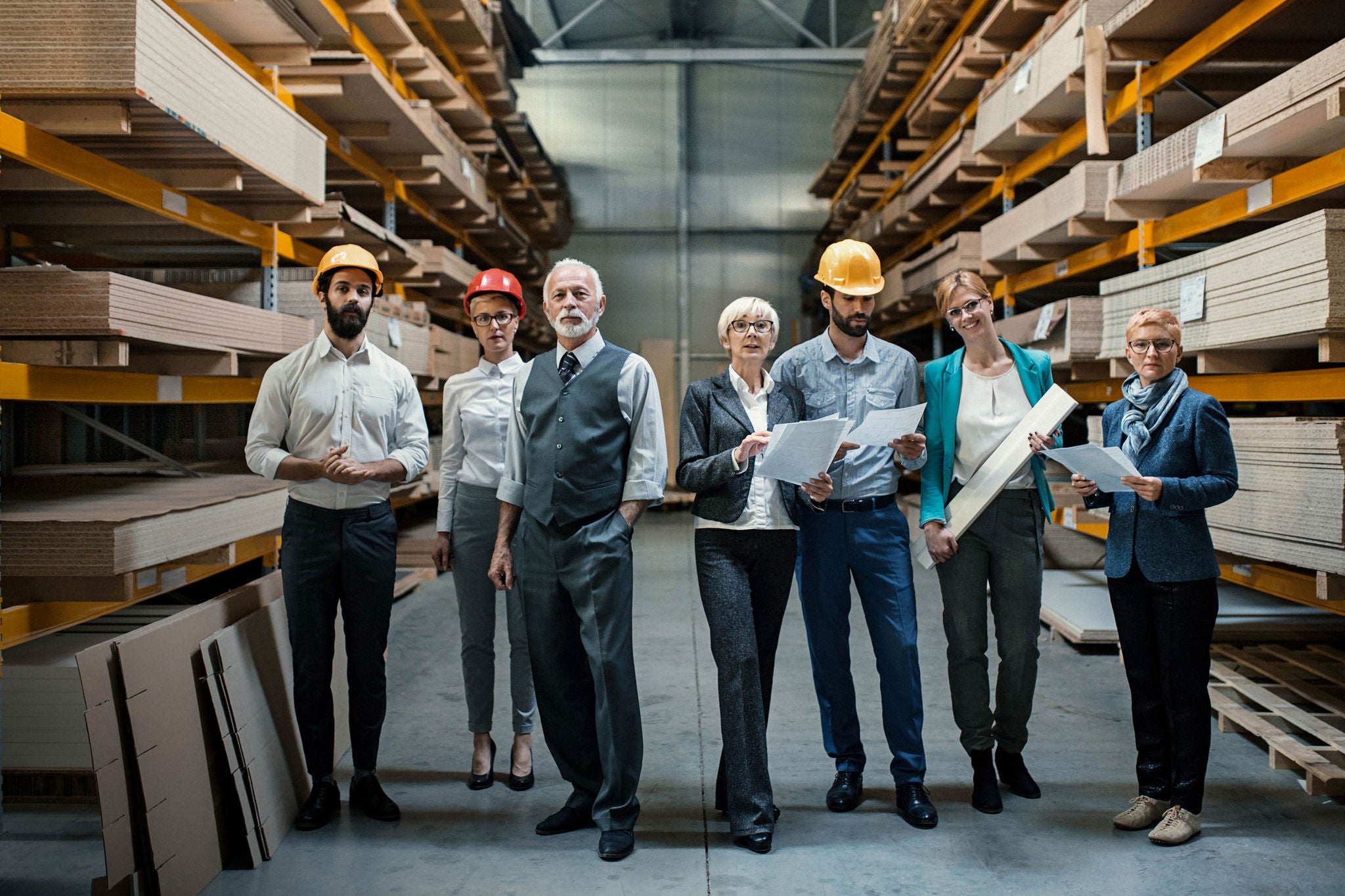 Family business owners standing in their factory