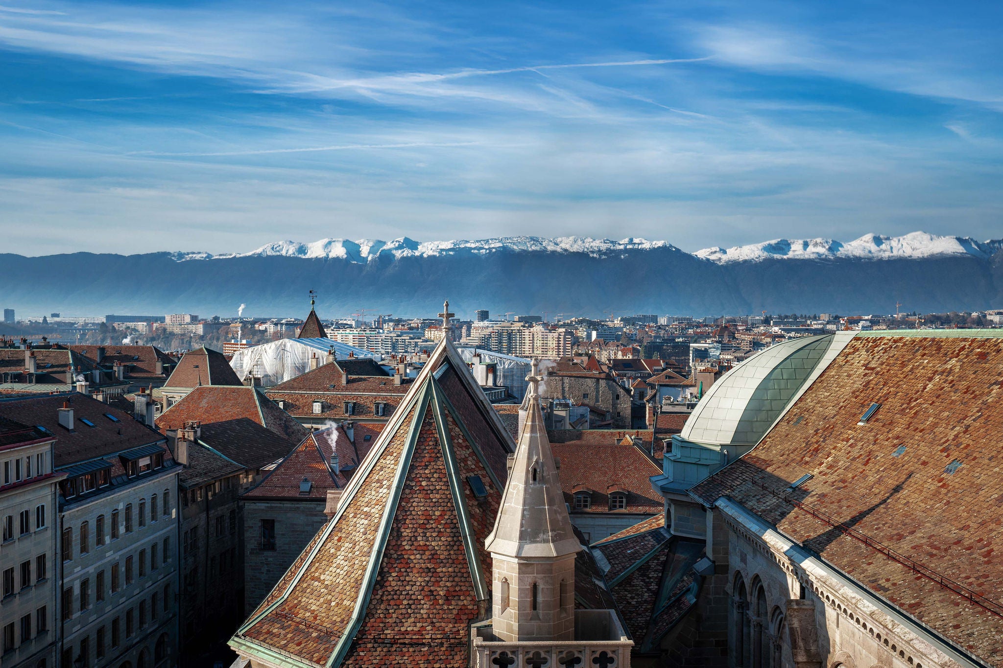 EY Aerial View of Geneva and St Pierre Cathedral with Alps Mountains on Background