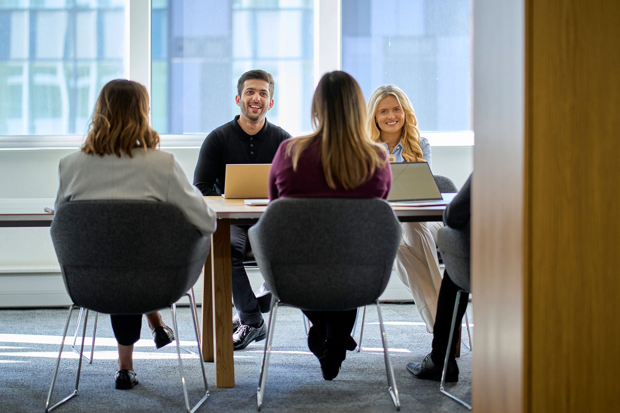 EY team sitting in a meeting