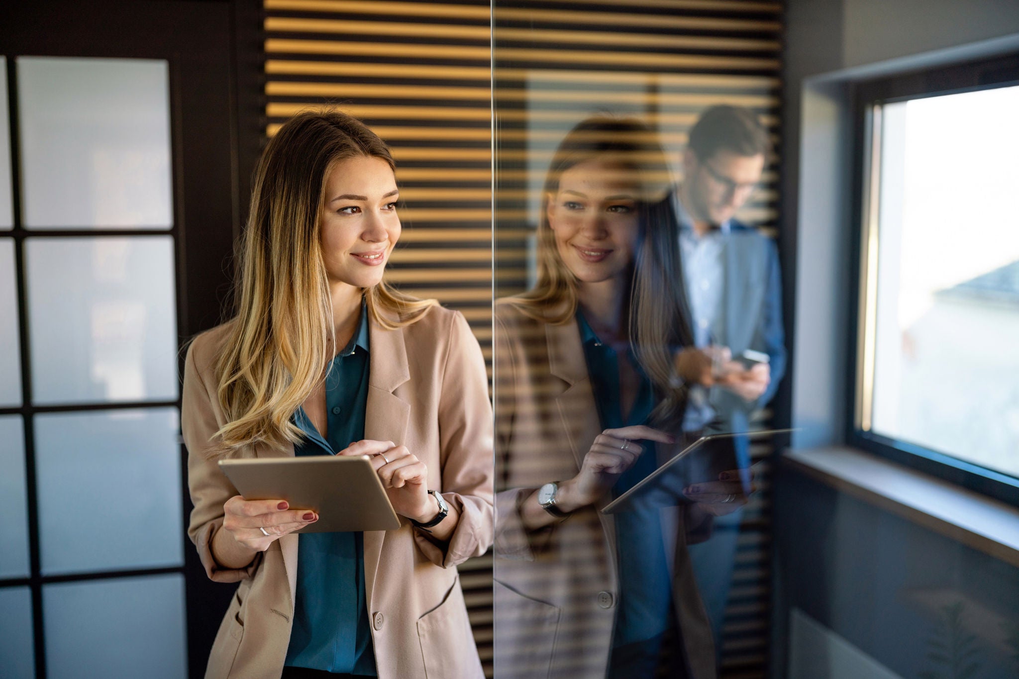 Professional business woman working with tablet in modern office