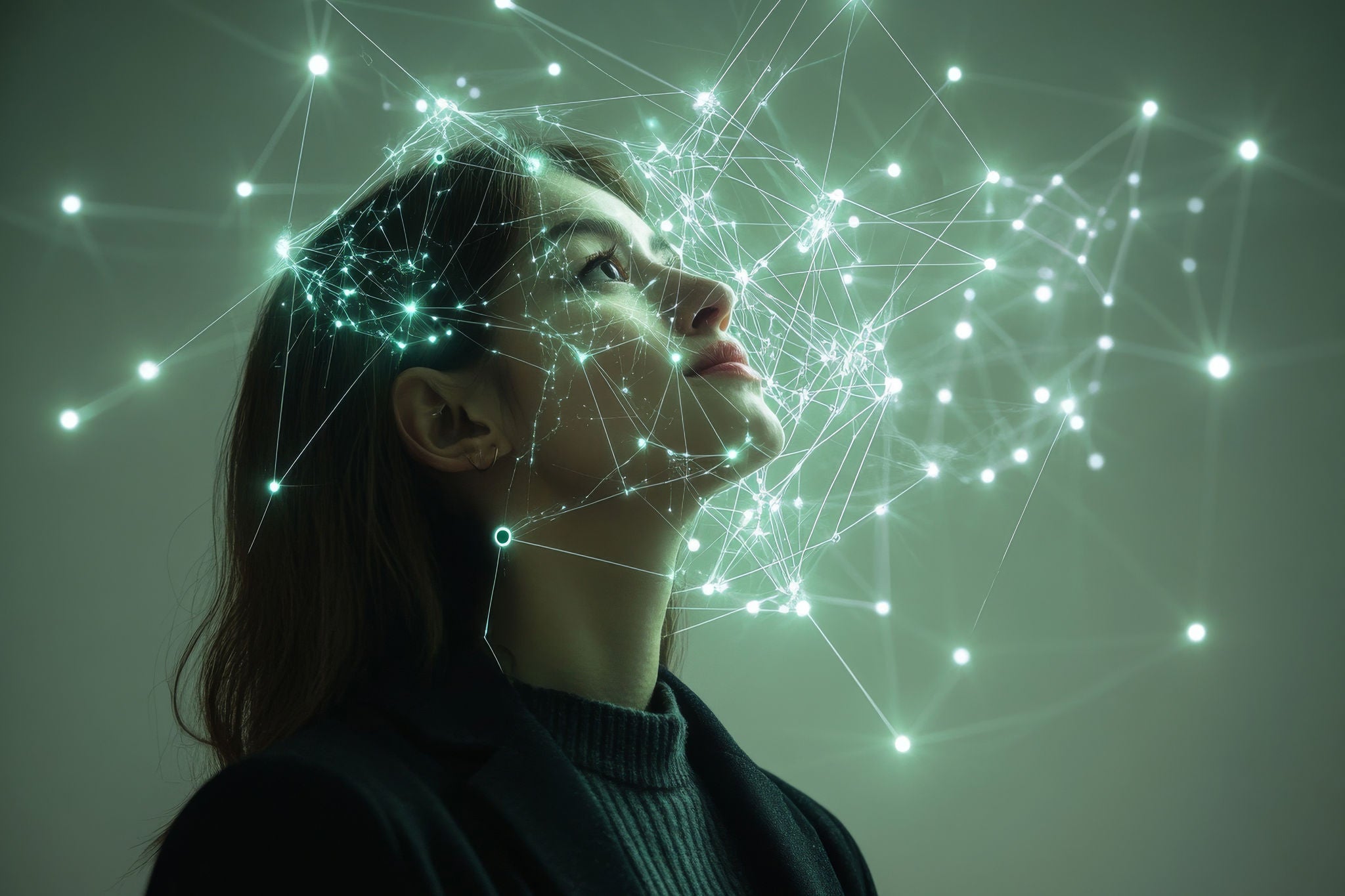 woman looking up with a neural network overlay on and beside her face