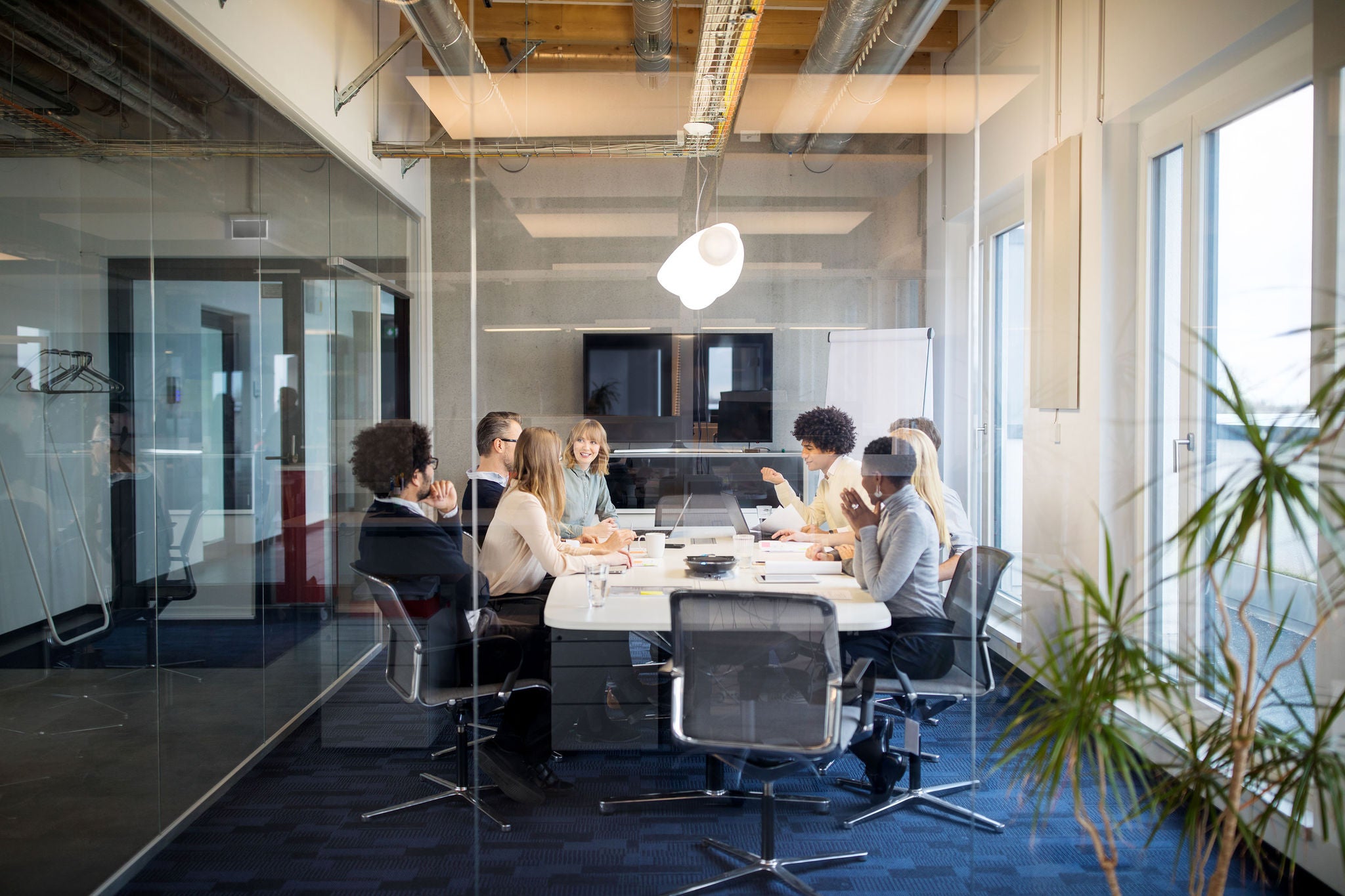  Bussiness people having board meeting in a modern office