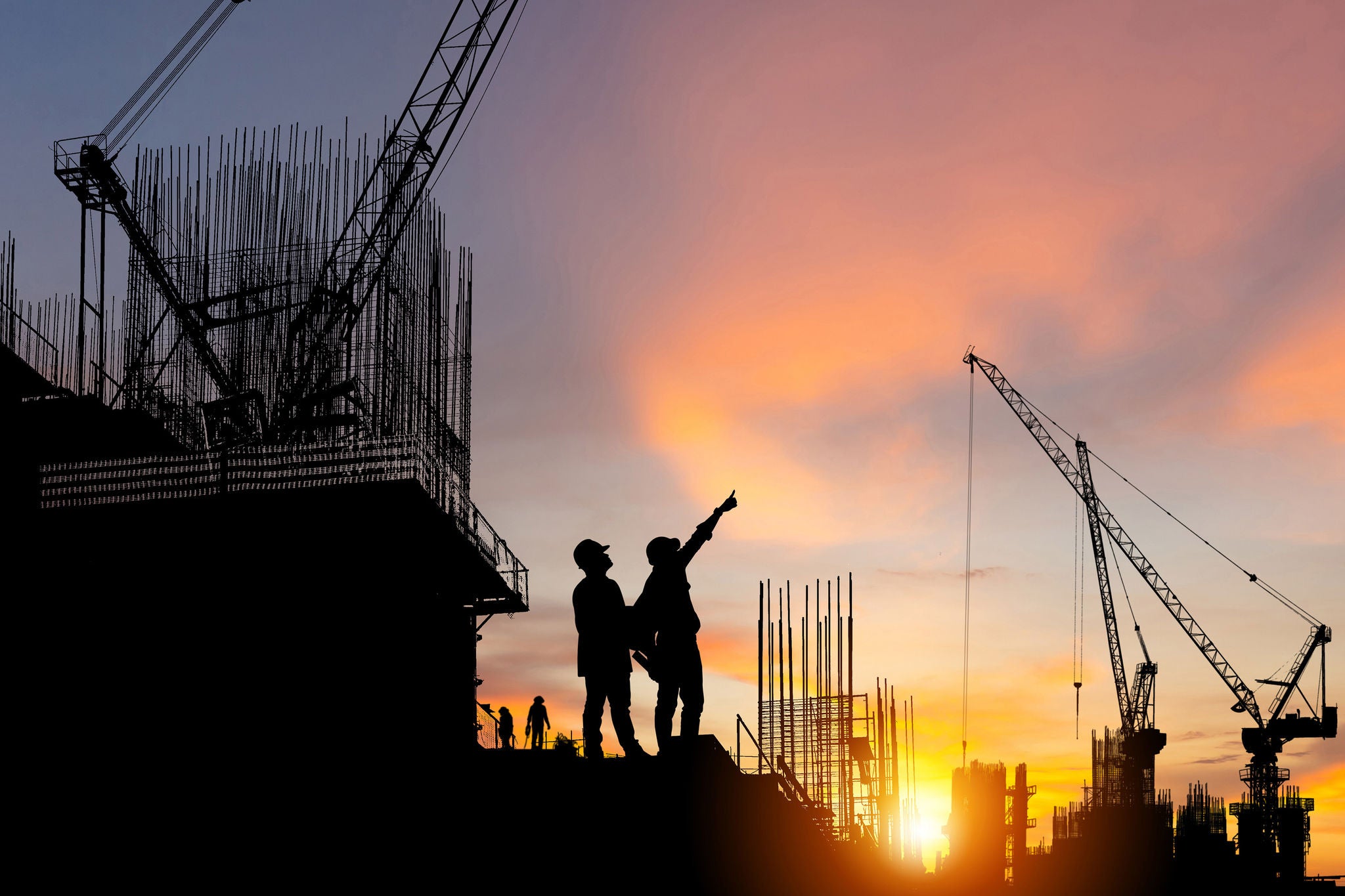 Engineer and worker on building site