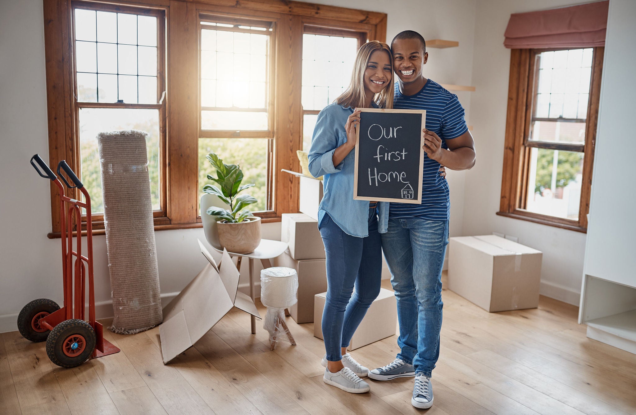 Couple holding up a blackboard