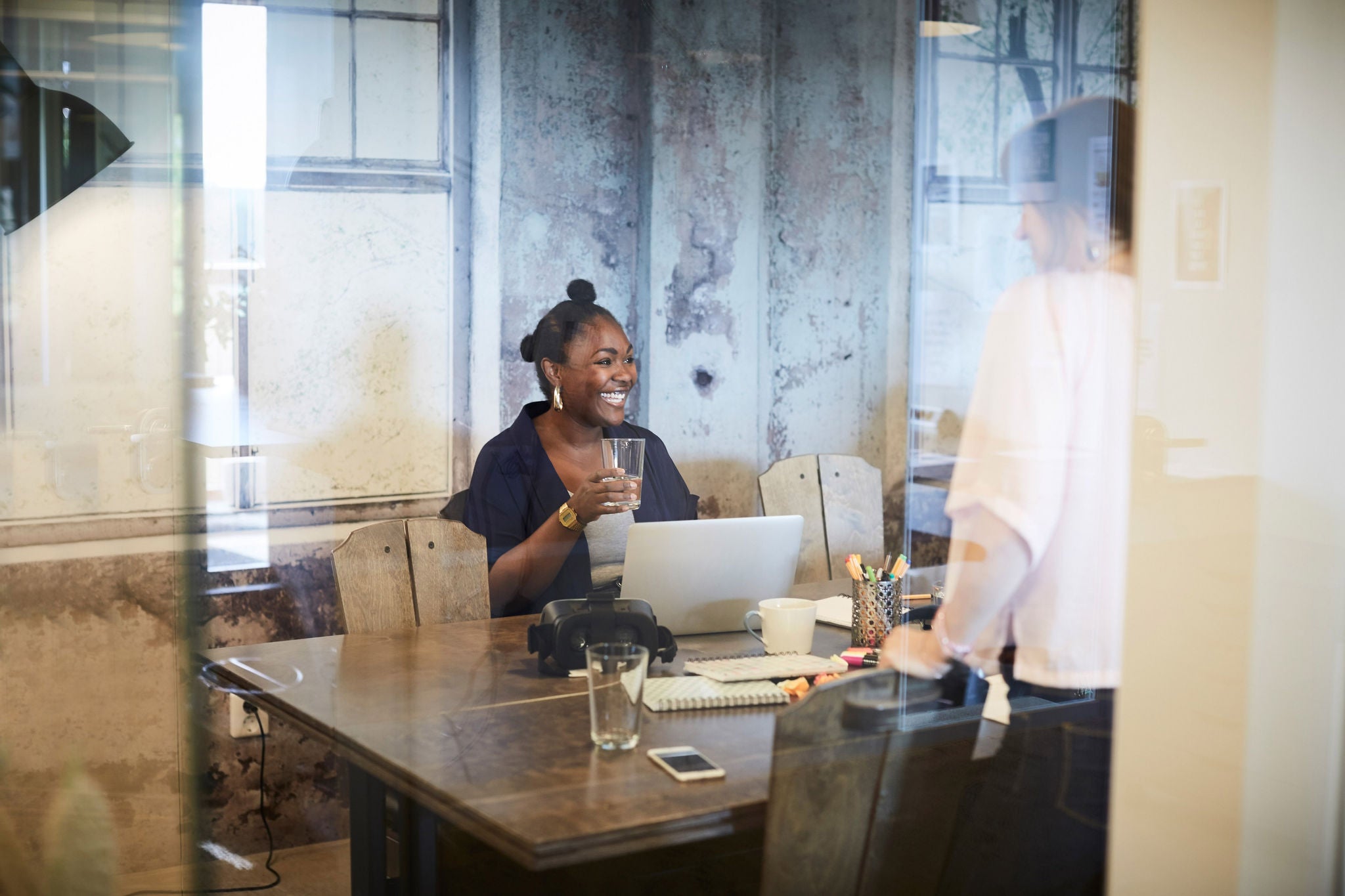 business woman in meeting with laptop