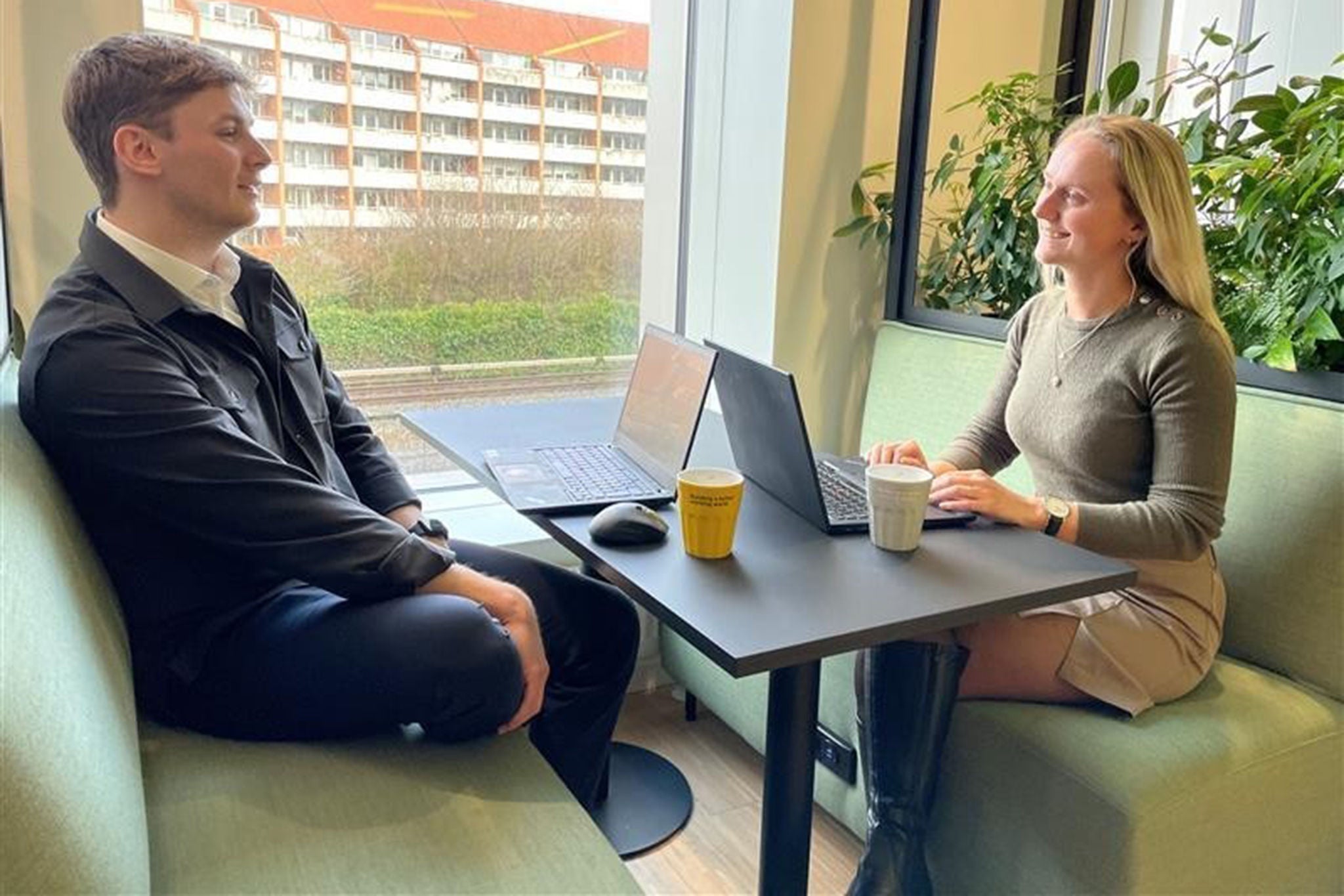 Picture of Nicoline and Christoffer having a cup of coffee.