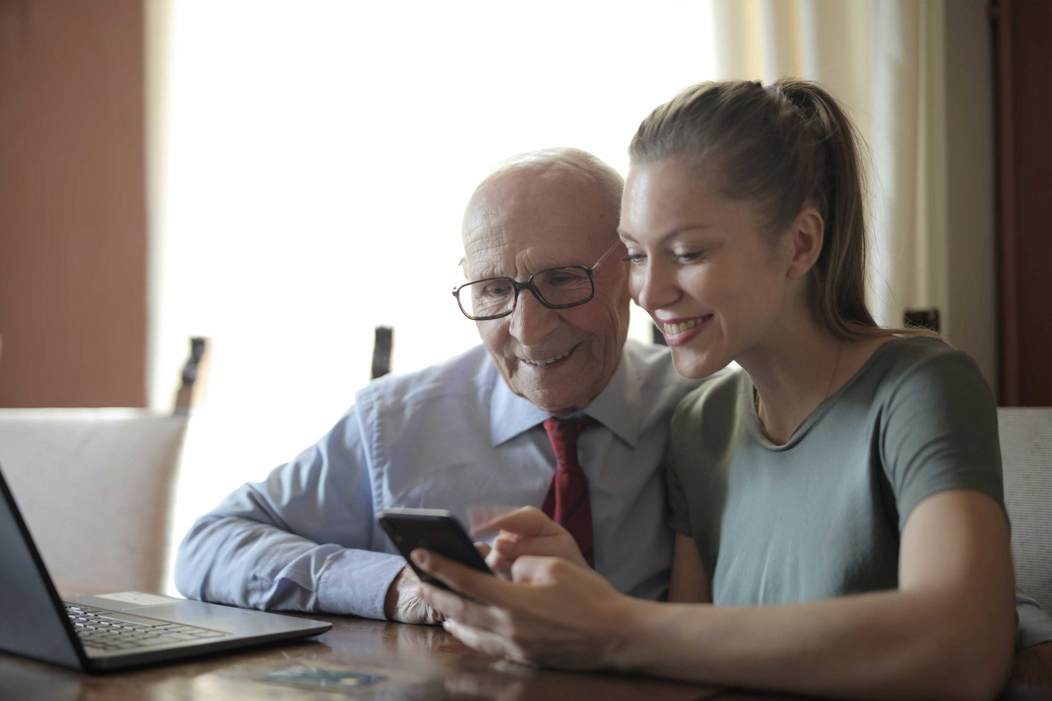 Two people looking at phone