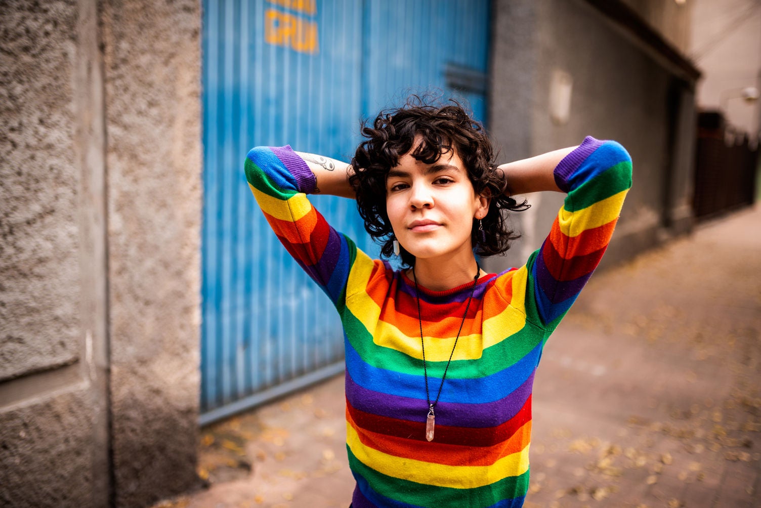 Portrait of a smiling Mexican woman. She is looking at the camera.