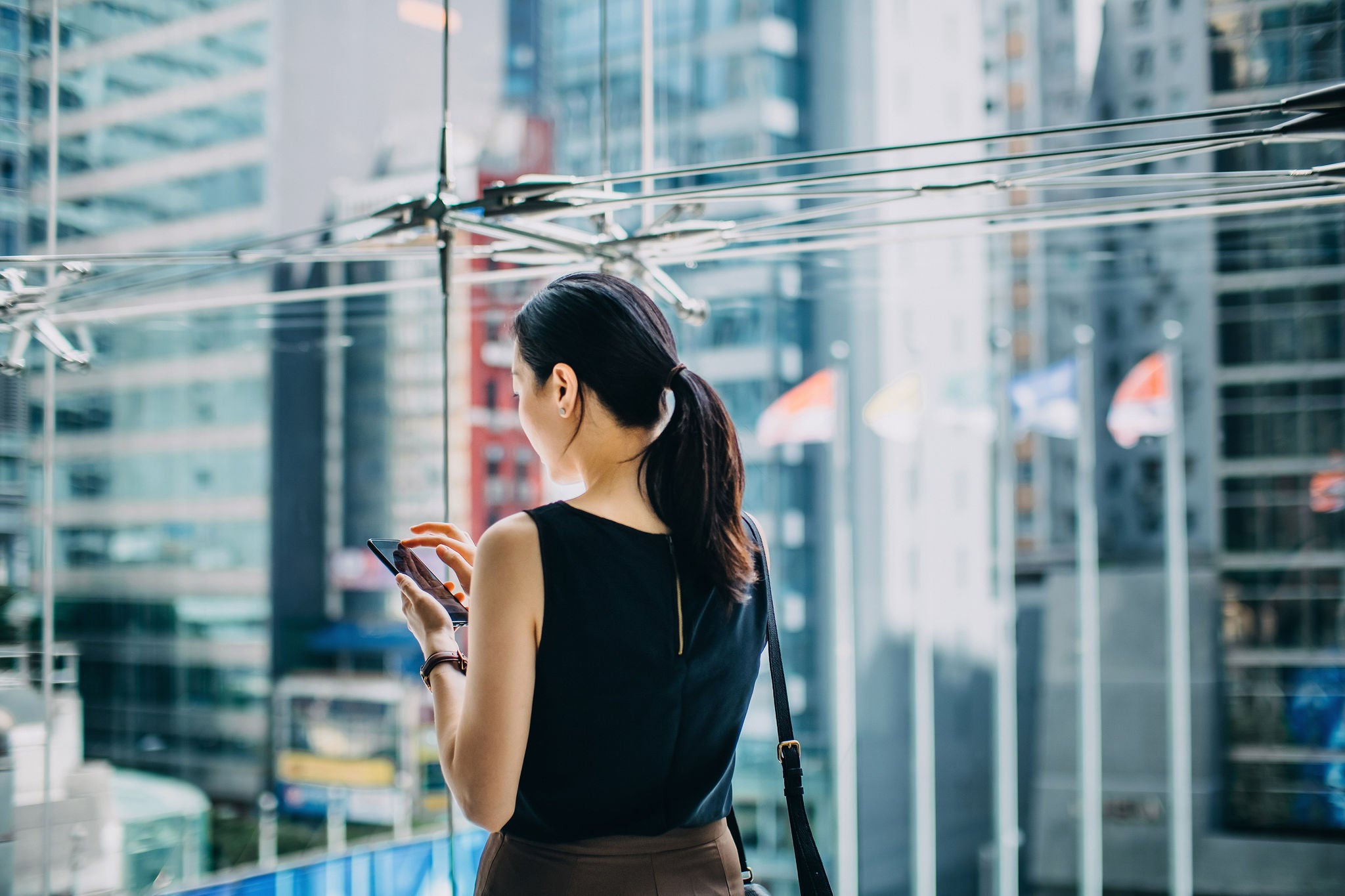 businesswoman text urban skyscrapers