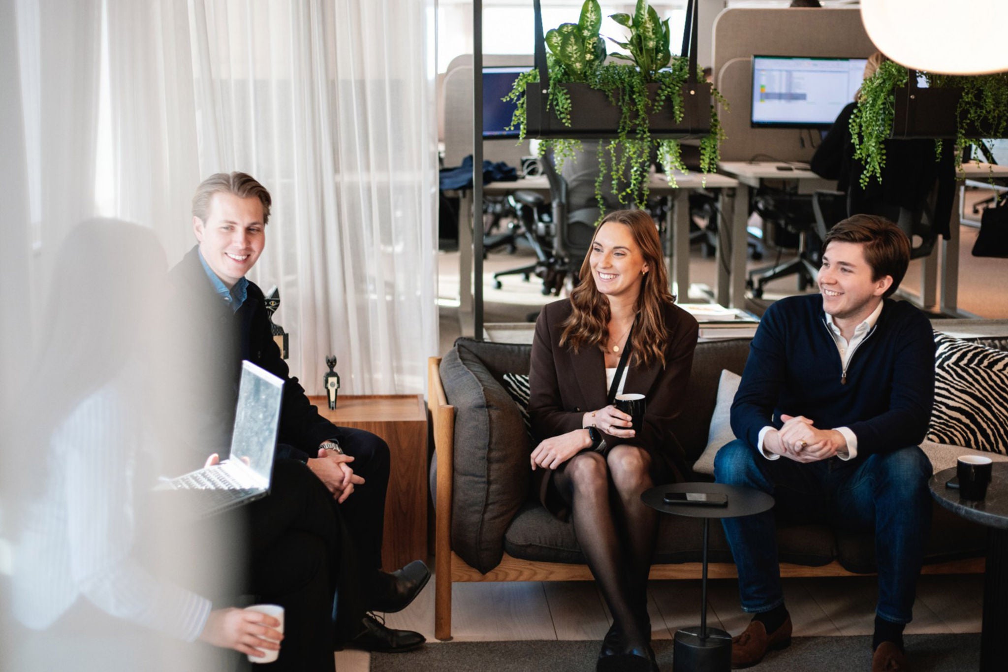 Group of colleagues sitting at meeting table