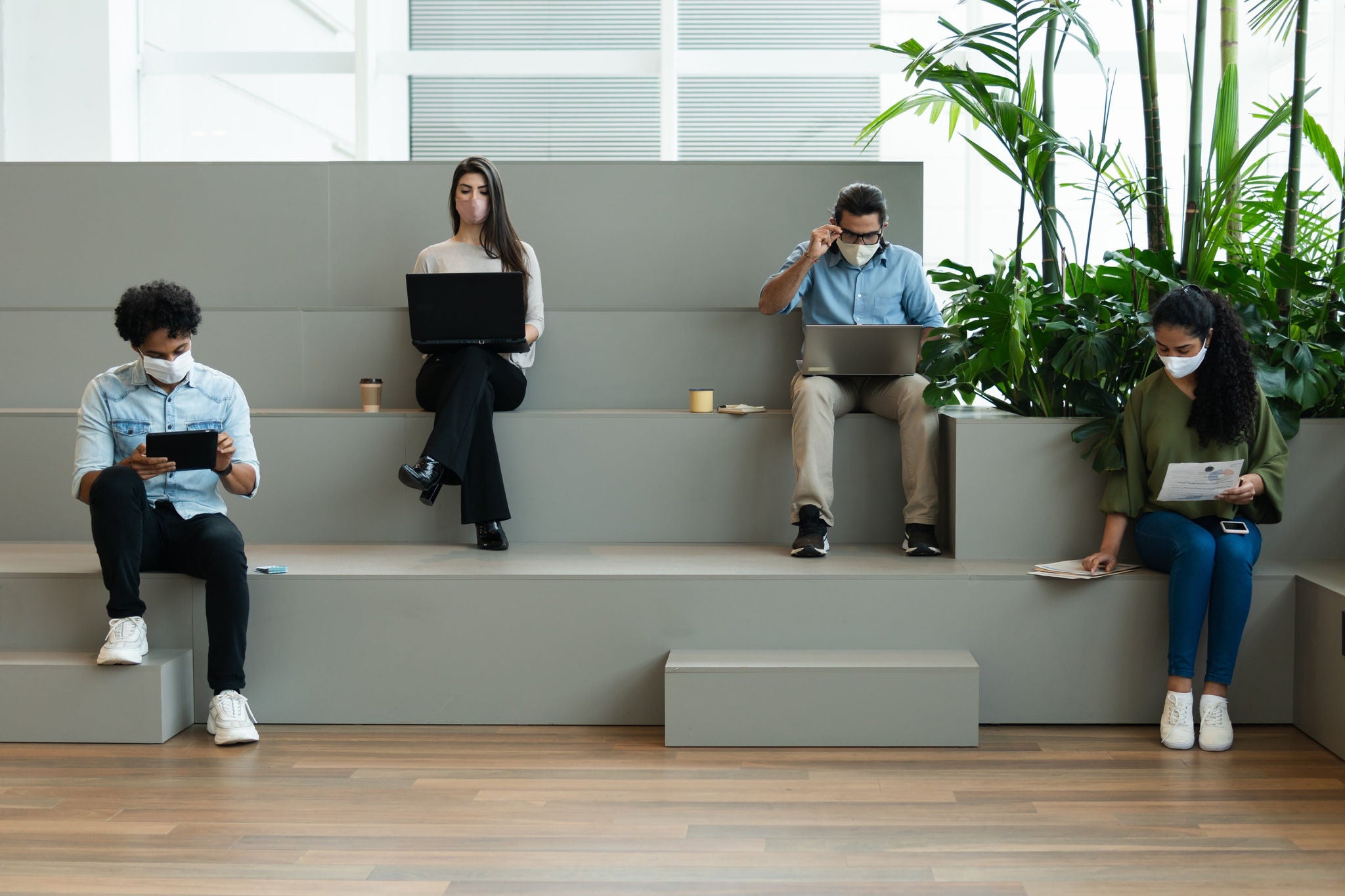 Group of entrepreneurs with face mask working in co working open space