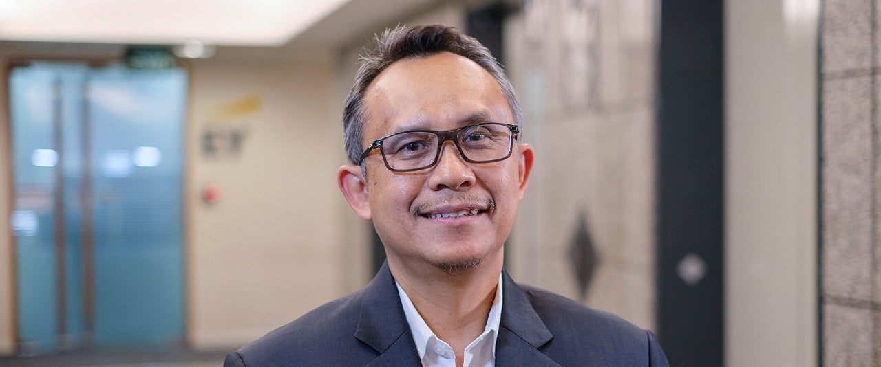 Photographic portrait of Iman Santoso