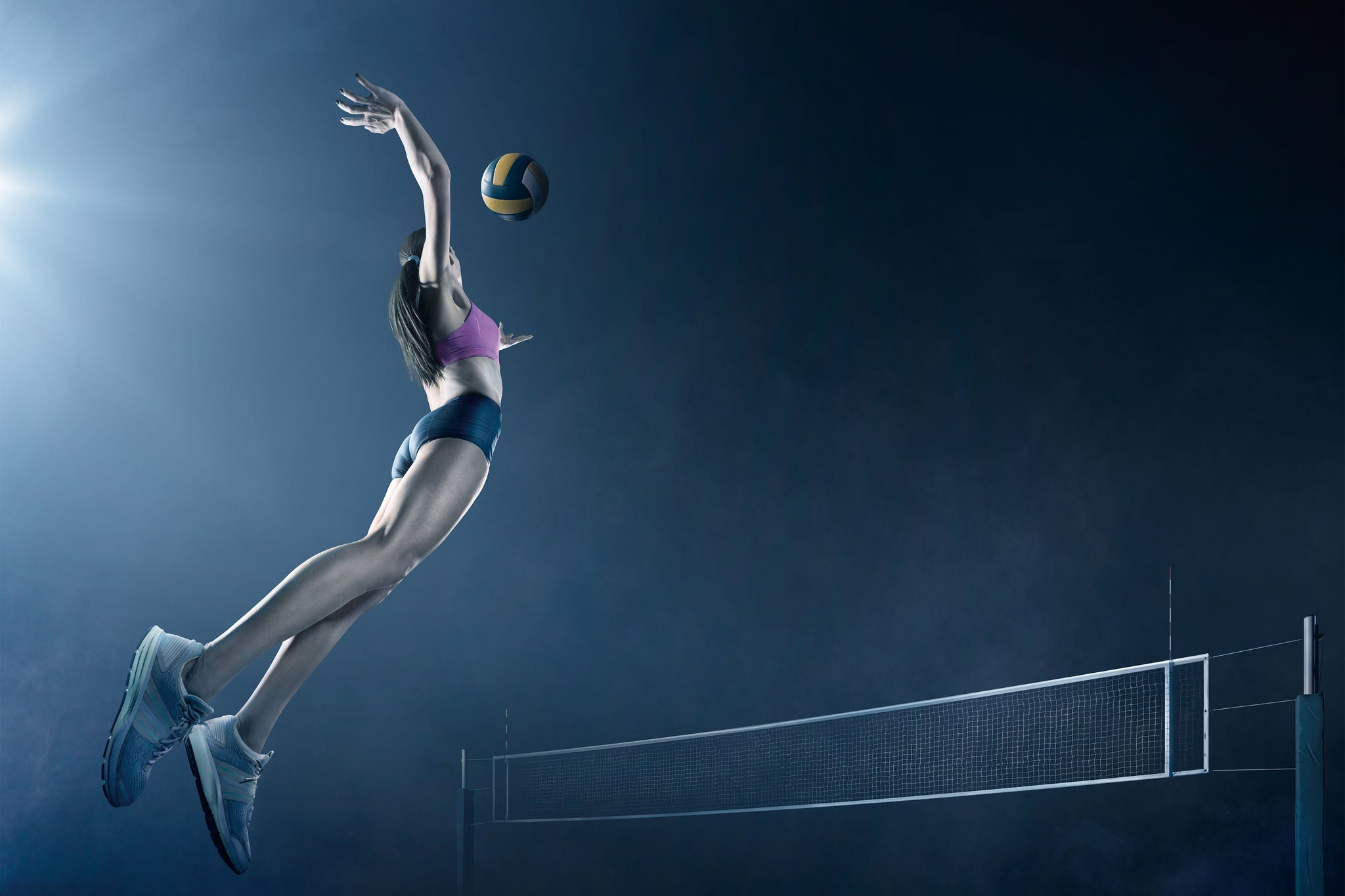 A woman playing volleyball 