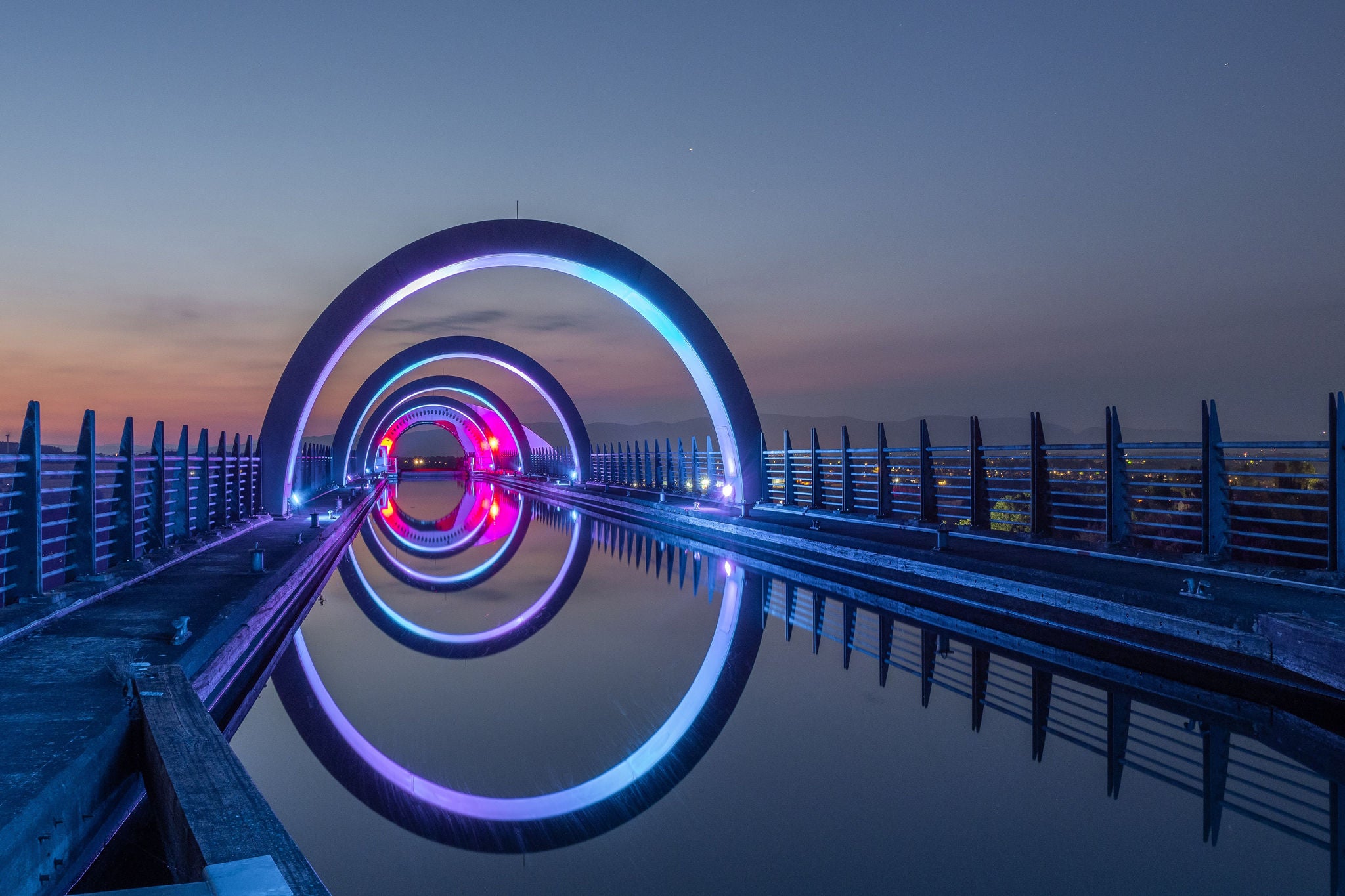 The canal leading to the top of the Falkirk Wheel. The Falkirk Wheel is a rotating boat lift in Scotland connecting the Forth and Clyde Canal with the Union Canal.