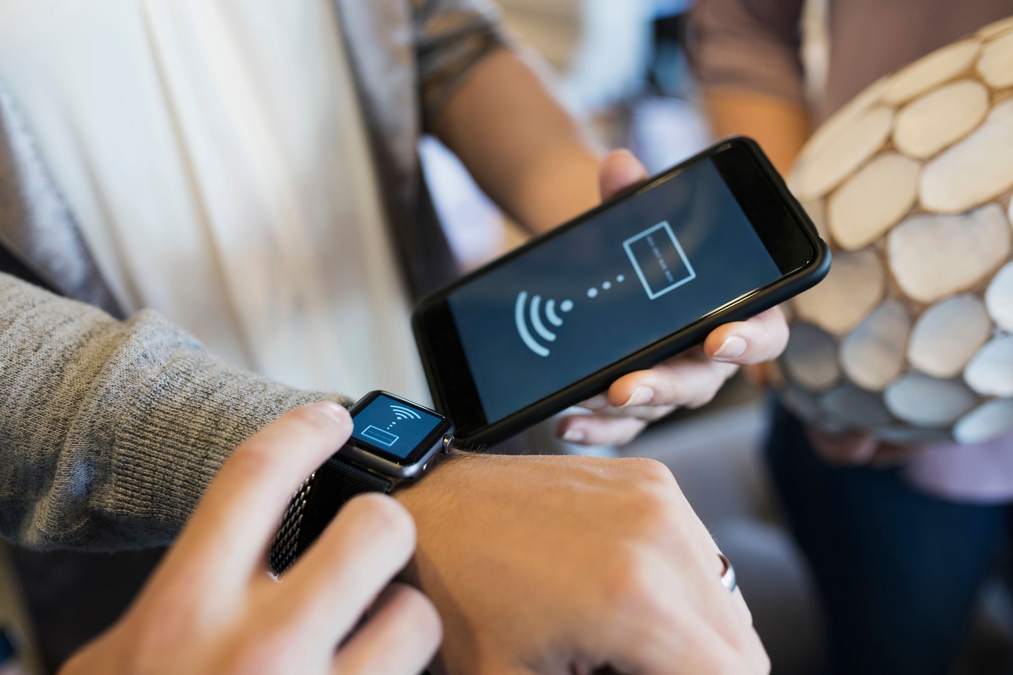 Close up man paying using smart watch contactless payment