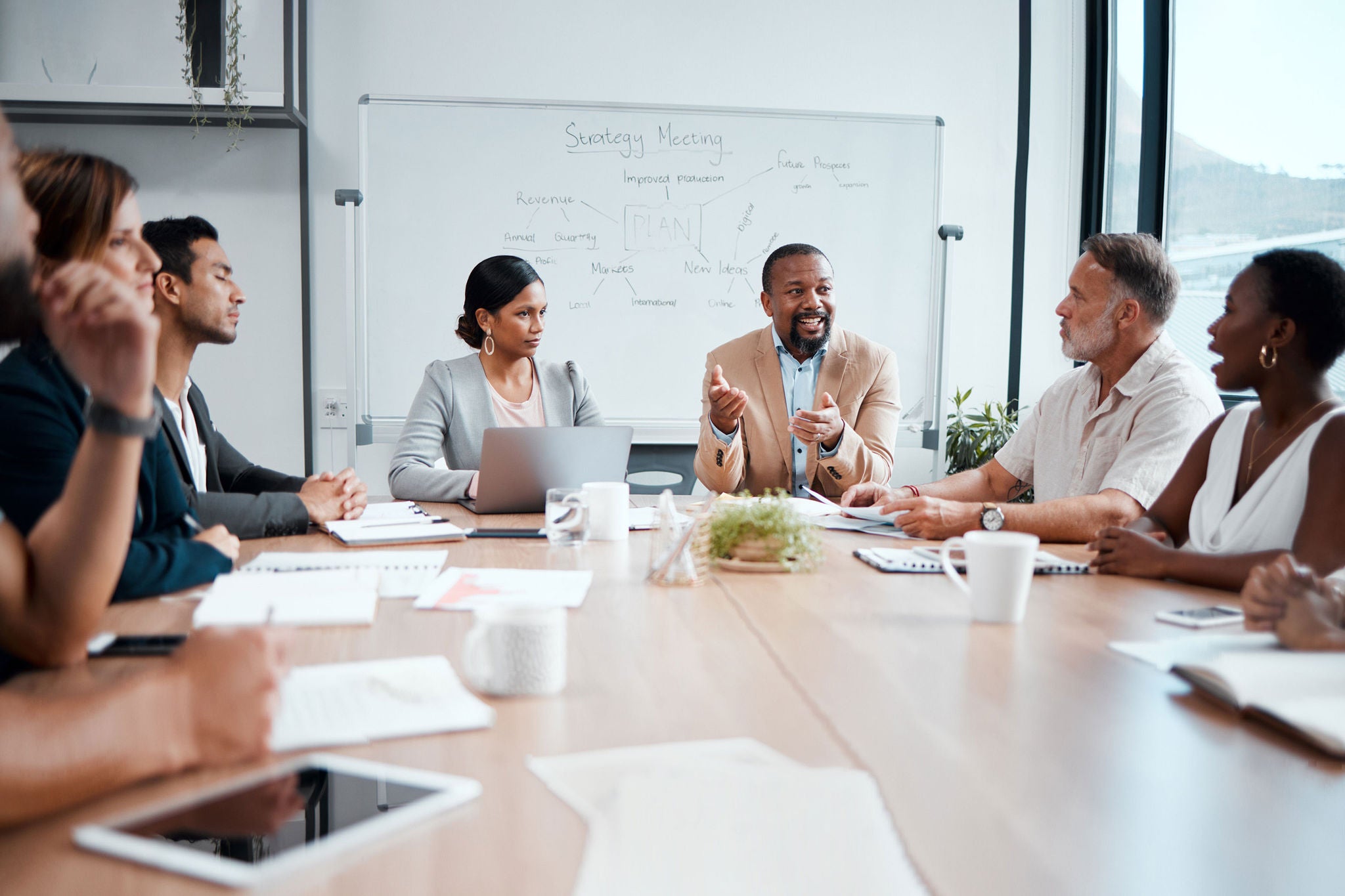 Business people, teamwork and meeting for strategy, planning or corporate brainstorming discussion at office. Group of employees in team collaboration or communication in conference at the workplace