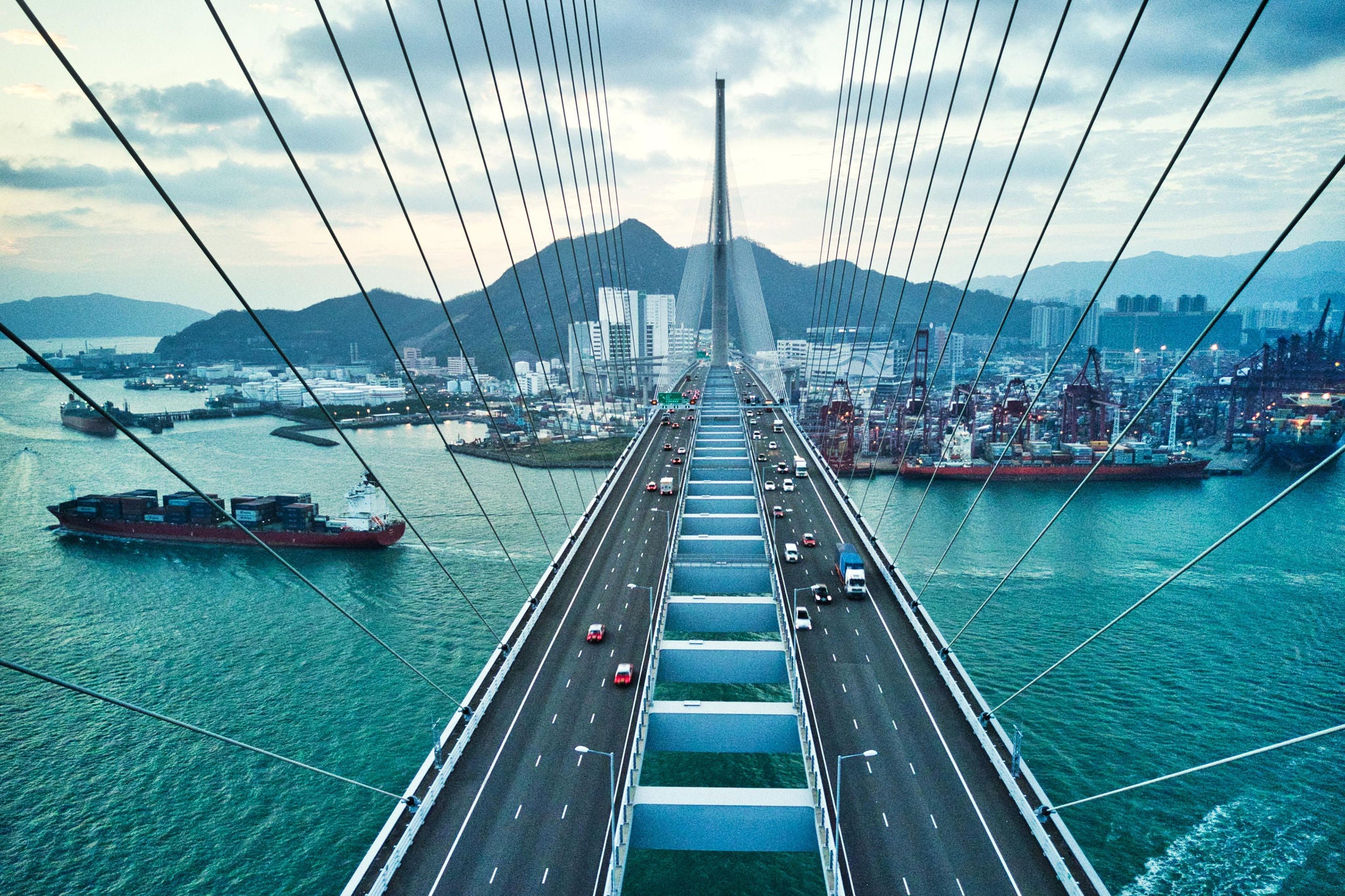 Hong Kong Bridge with Container Cargo freight ship below