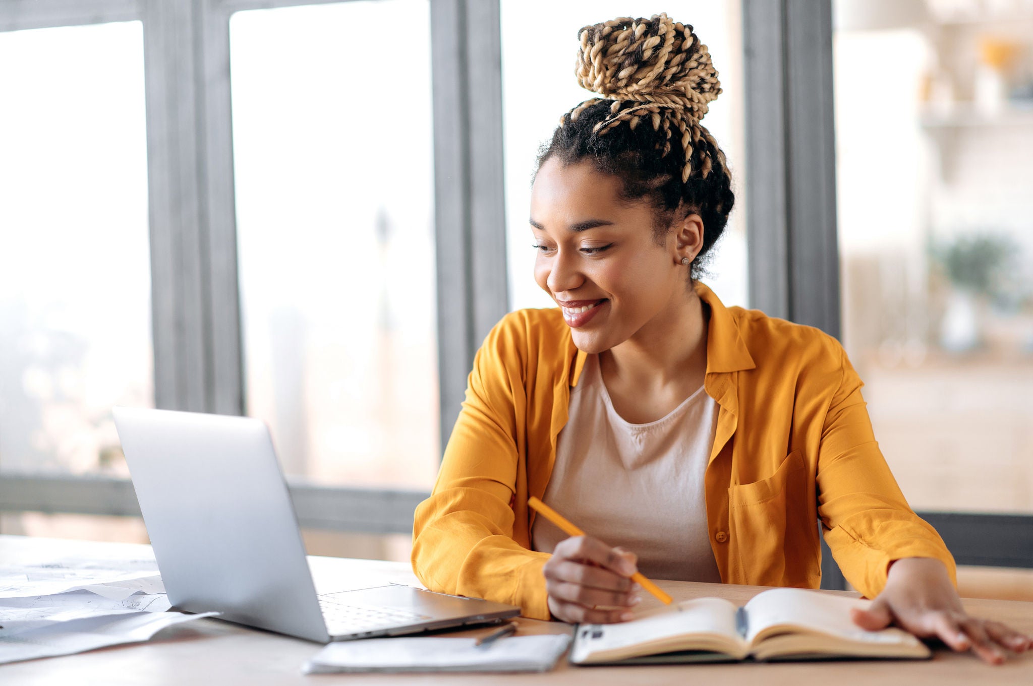 Person studying and using a laptop