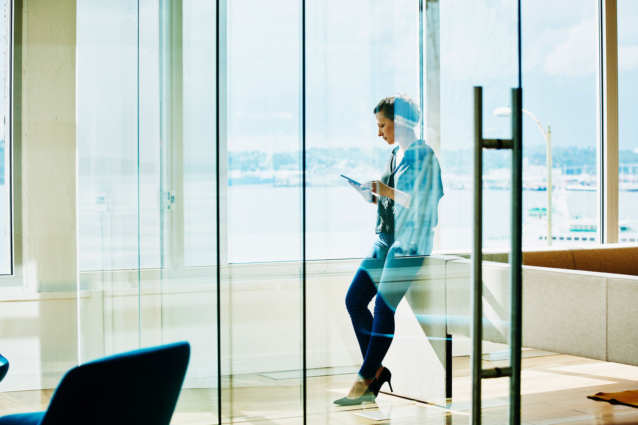 Businesswoman working on project on digital tablet in office