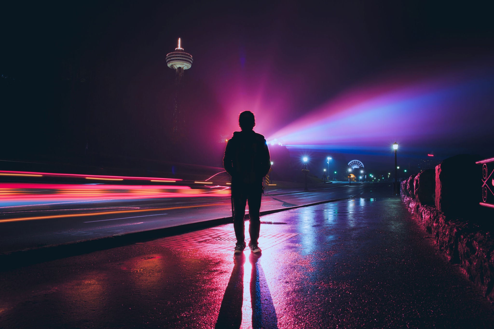 Silhouette of man with spectacular colorful light source as background