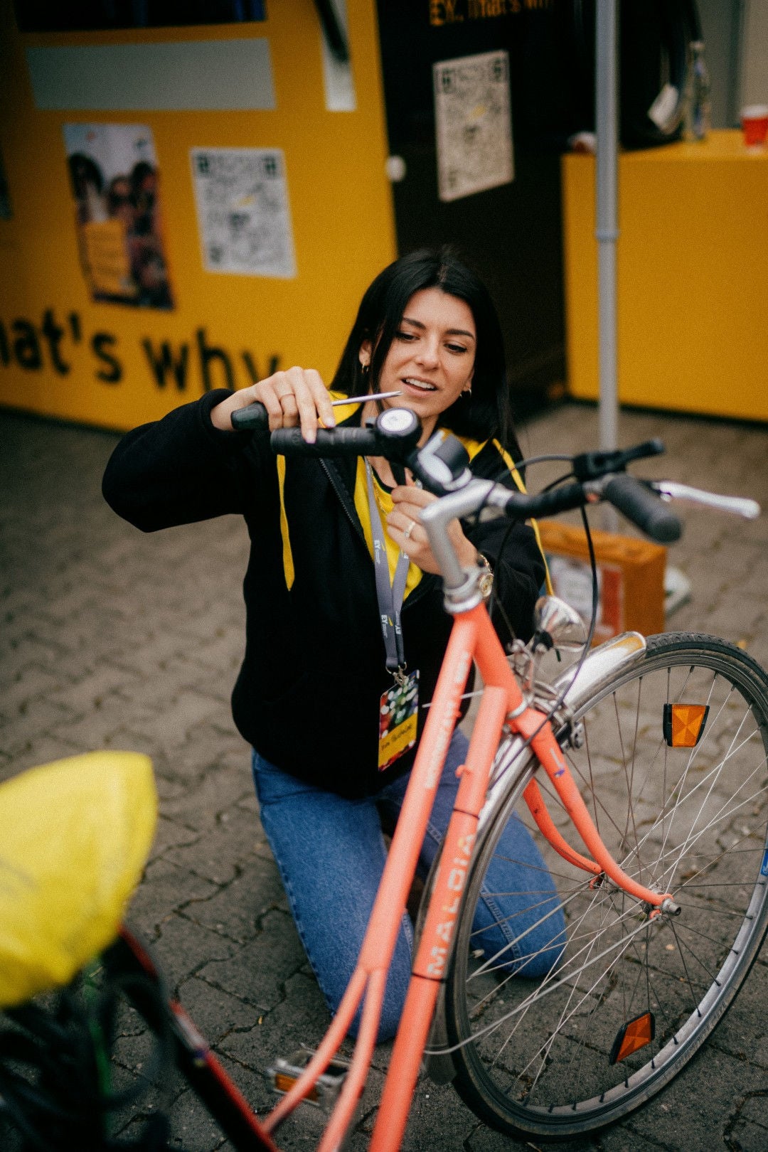 A women doing some repair to bicycle