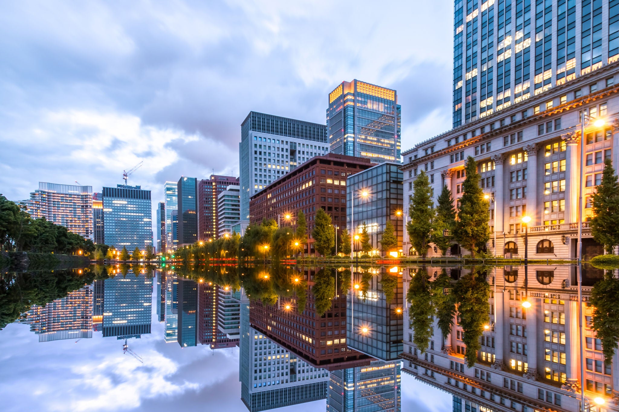 Tokyo skyline with skyscrapers and office buildings illuminated reflection