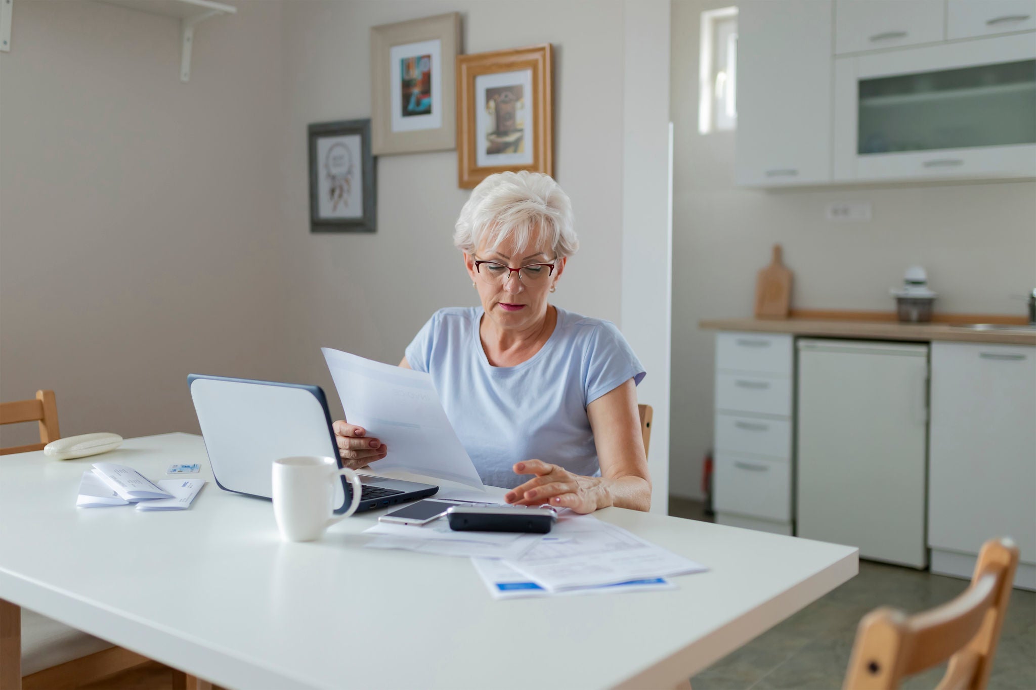  Senior Woman Online Banking While Planning Her Home Budget