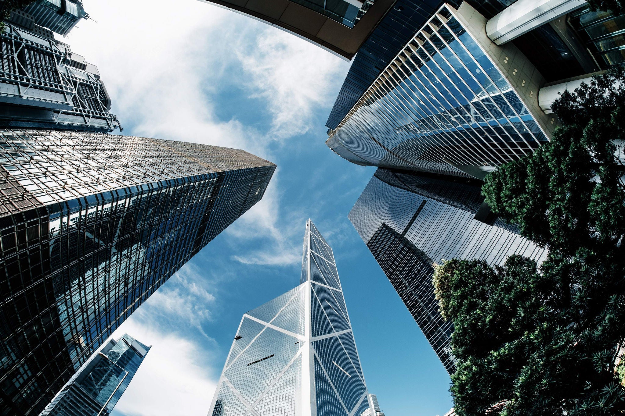 Low angle view of contemporary corporate skyscrapers with urban architectural design in downtown financial district