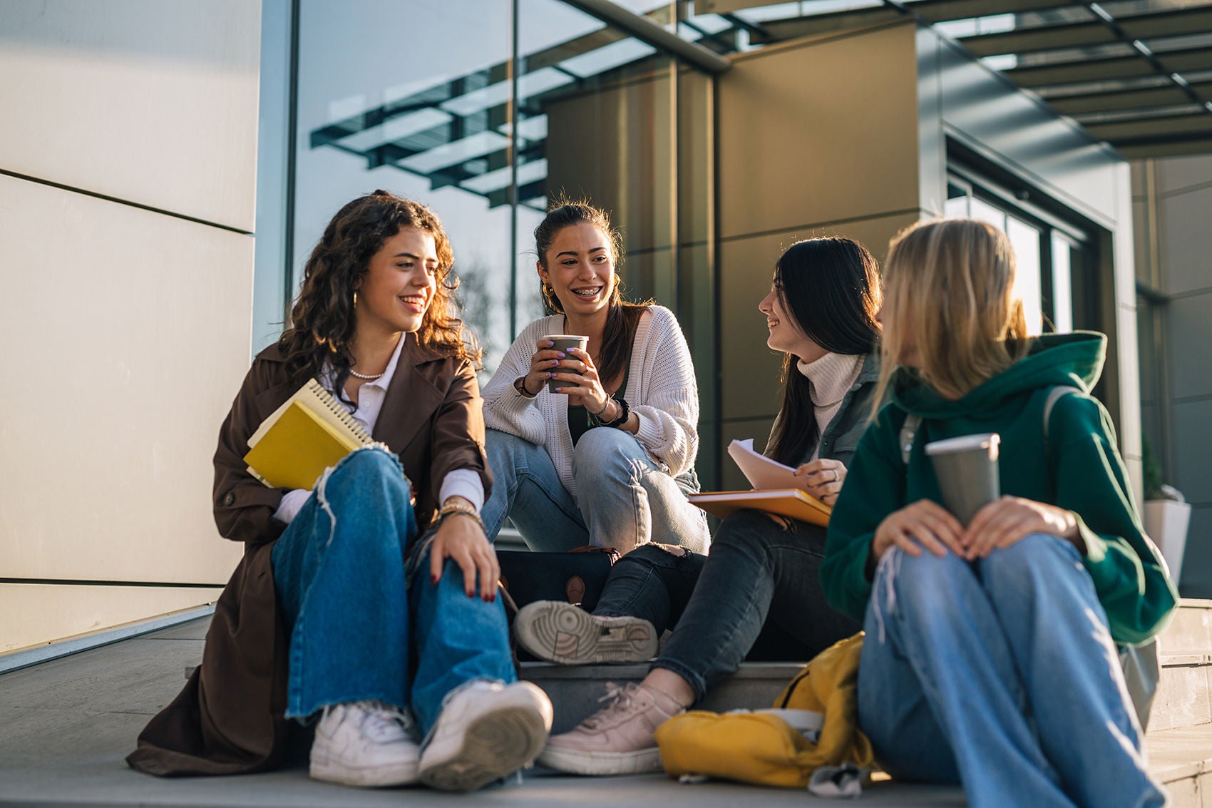 group of female college students outdoor in campus talking